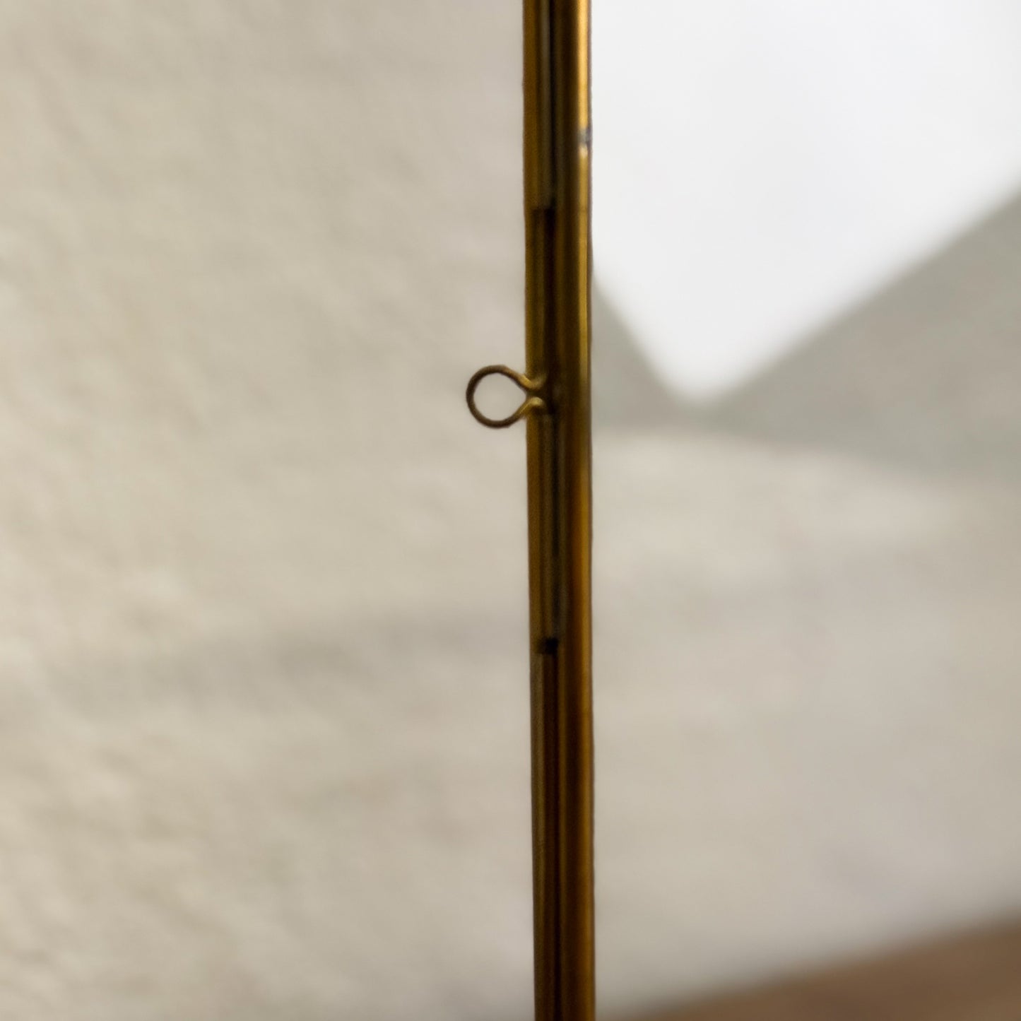 Close-up of a brass door handle on a white door