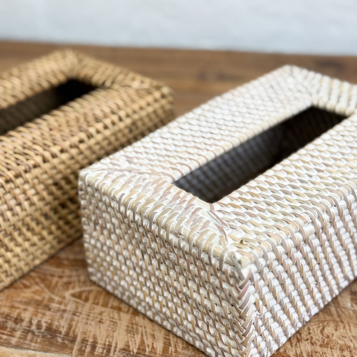 Woven tissue box cover on a wooden surface