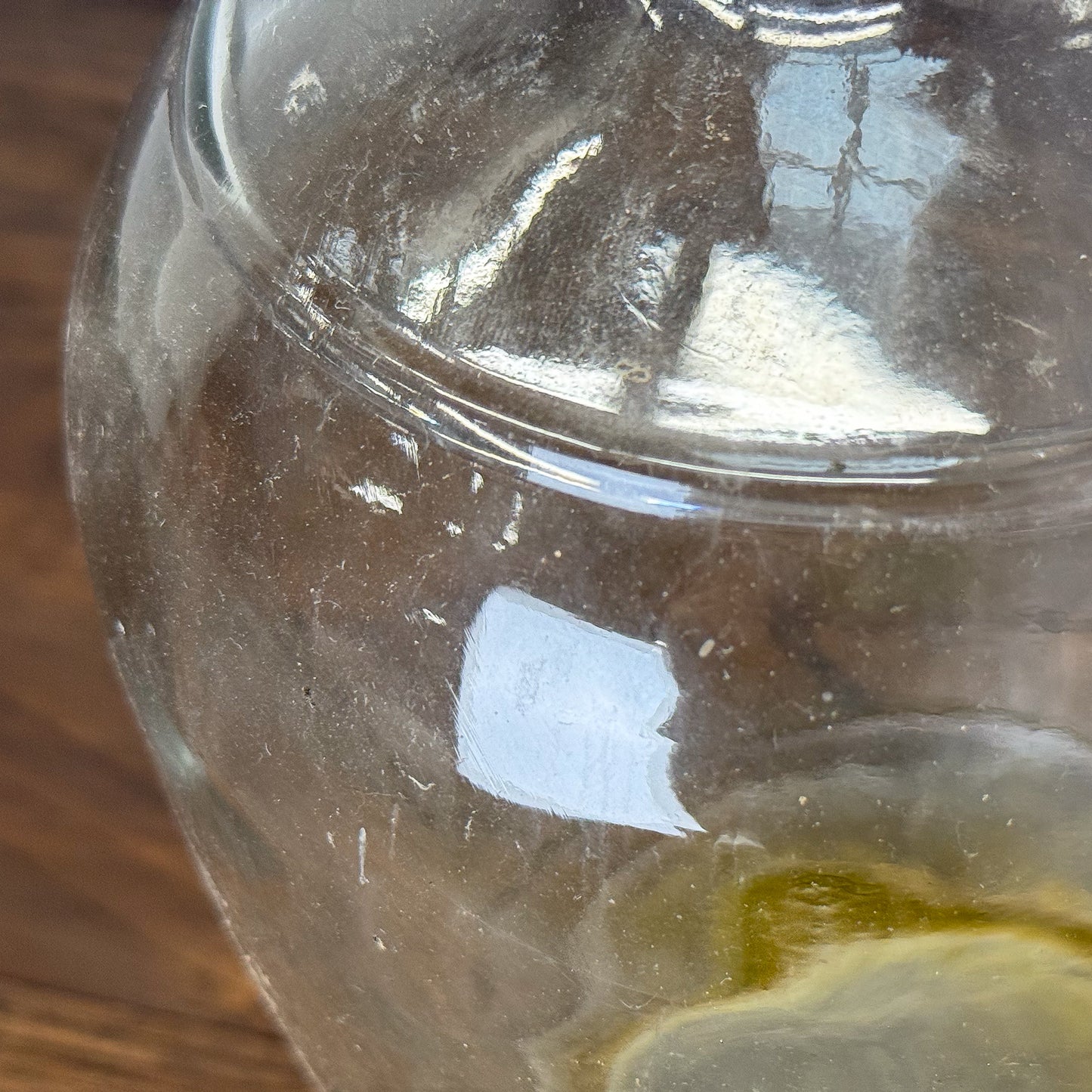 Clear glass vase on a textured white background