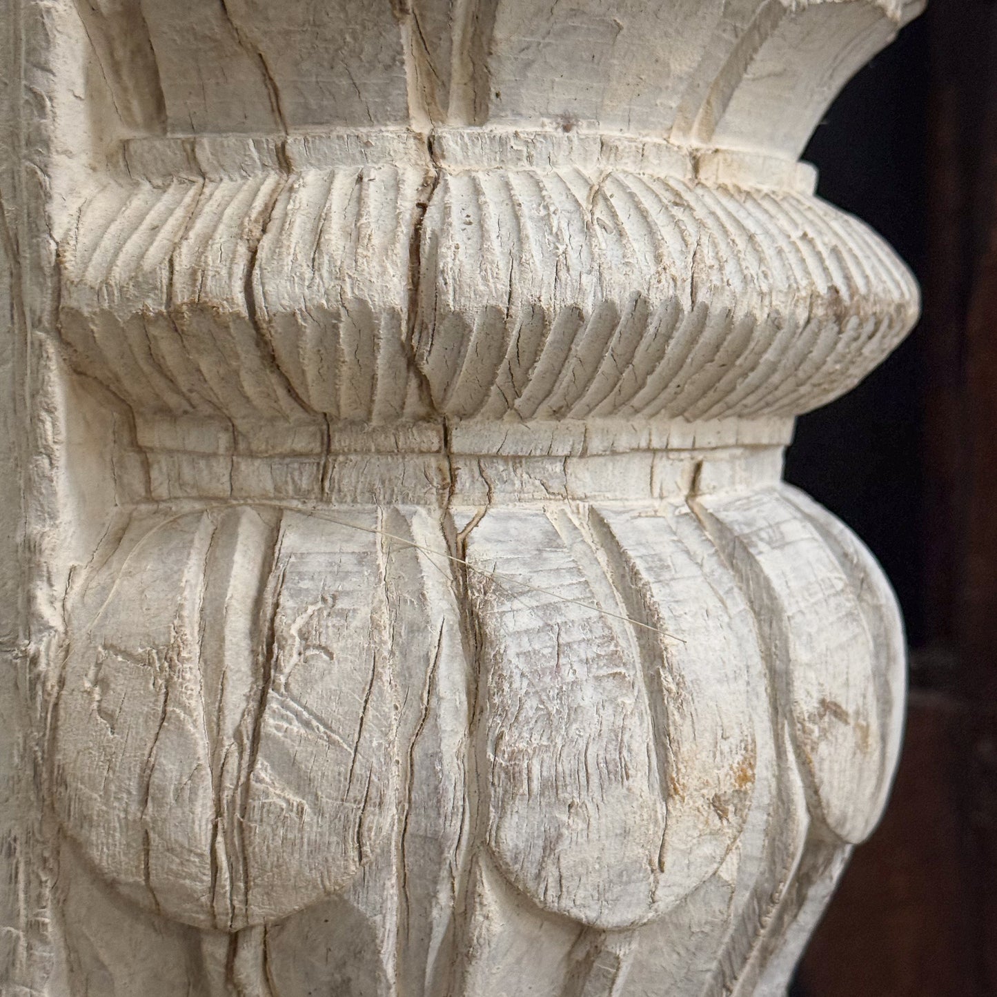 Close-up of a stone architectural detail with intricate carvings.