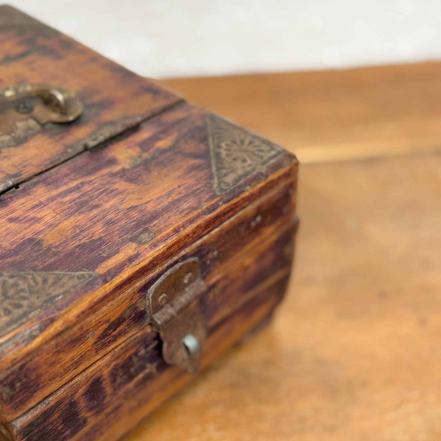 A vintage wooden shaving box with a built-in mirror and metal hardware, displaying signs of wear and patina.