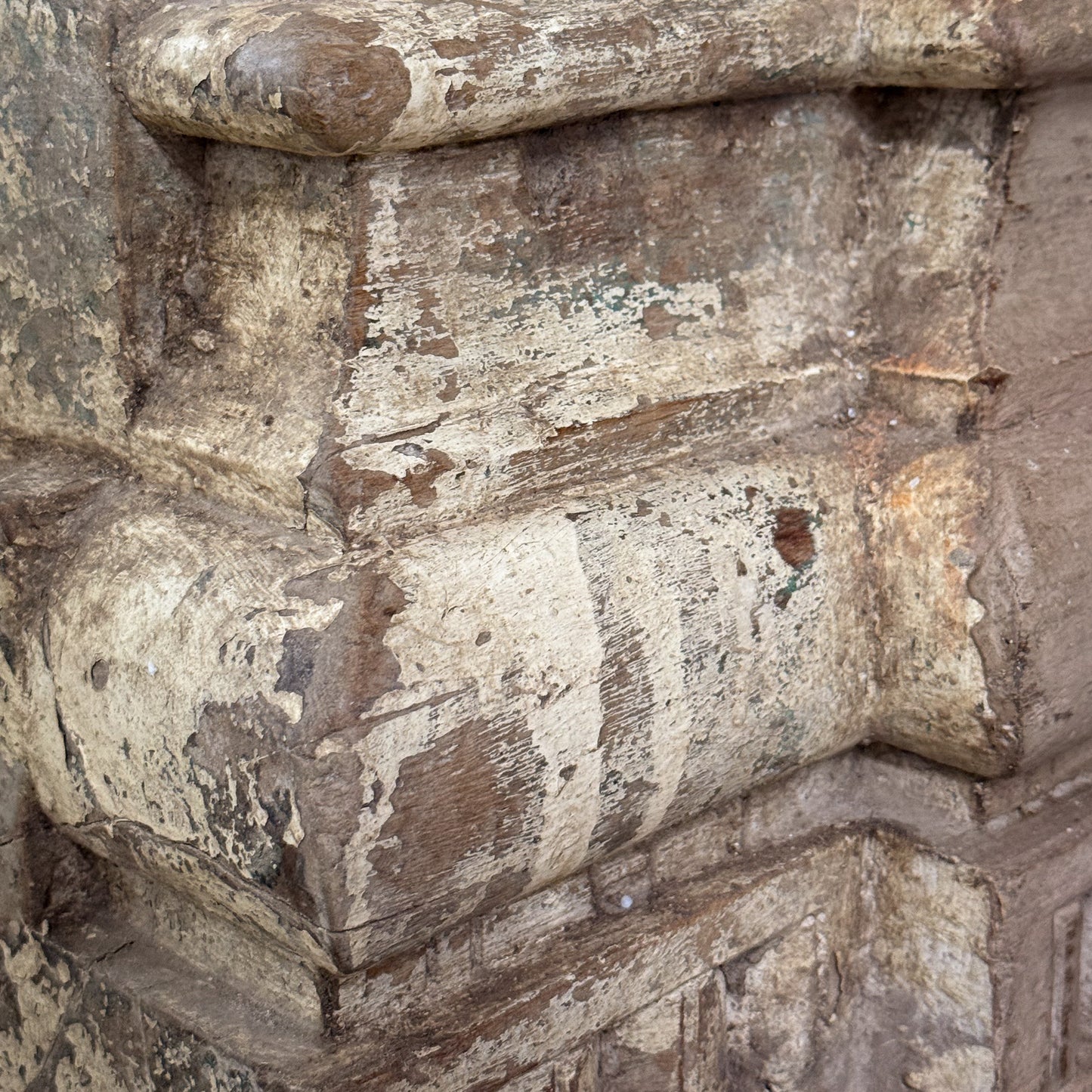 Close-up of a textured stone surface with architectural details