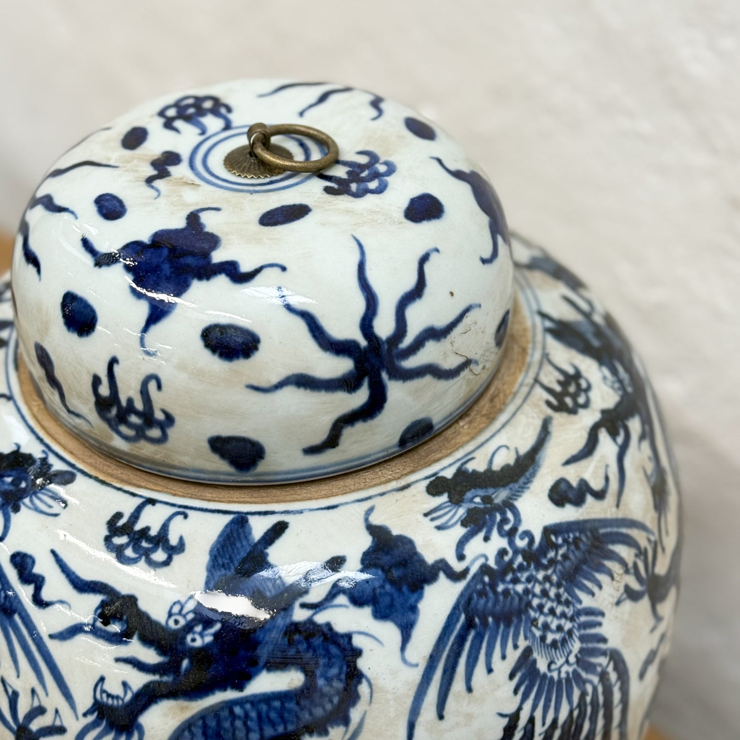 Ceramic jar with blue floral patterns on a white background