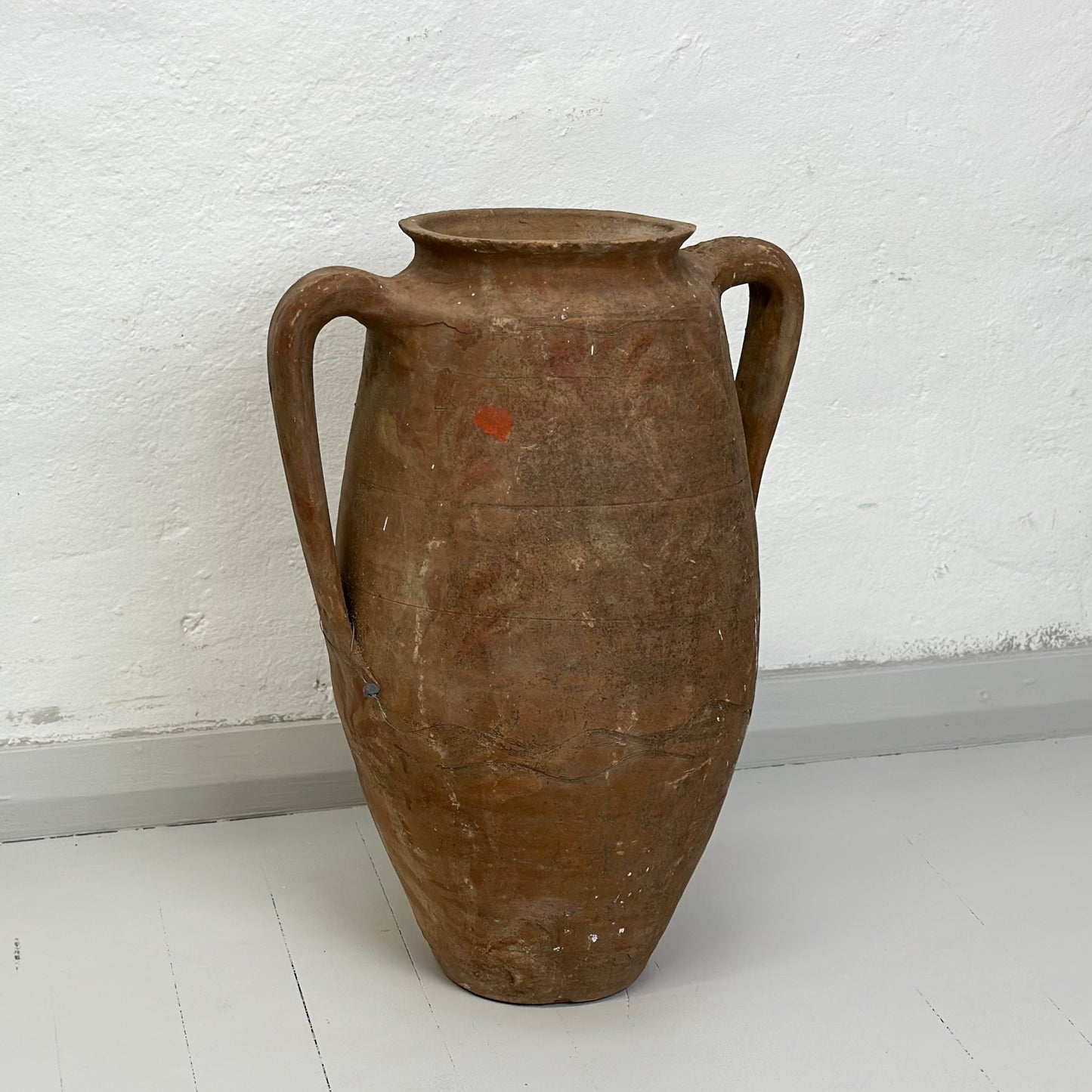 A brown ceramic Turkish amphora with two handles, displayed against a white background.
