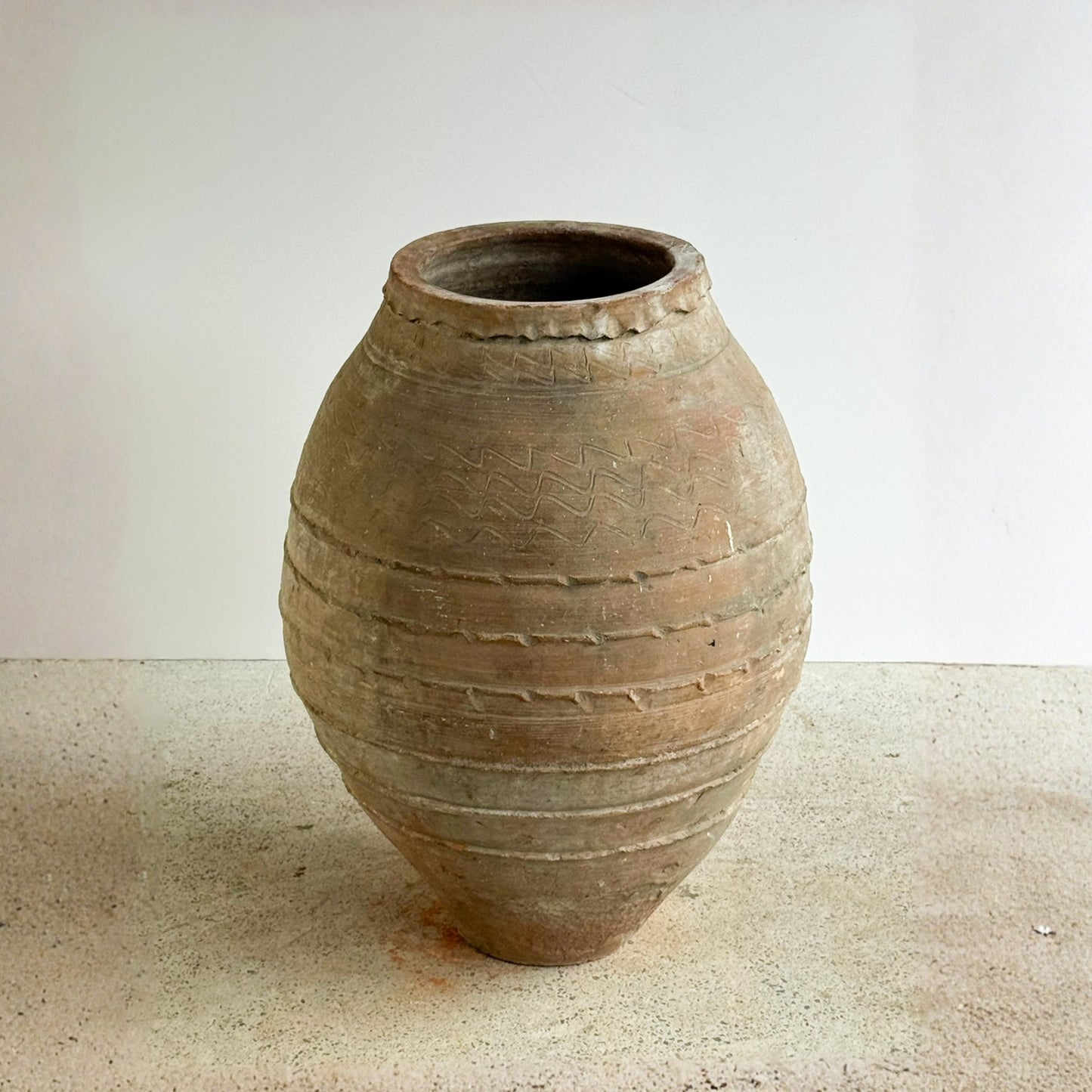 Terracotta pot on a neutral background