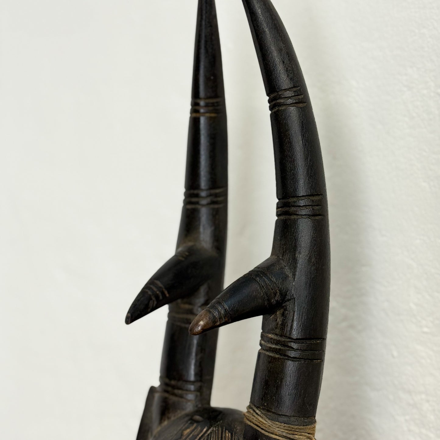 Carved wooden antlers on a white background