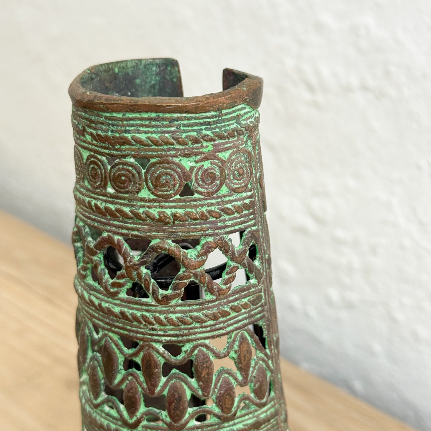 Decorative ceramic vase with intricate patterns on a white background