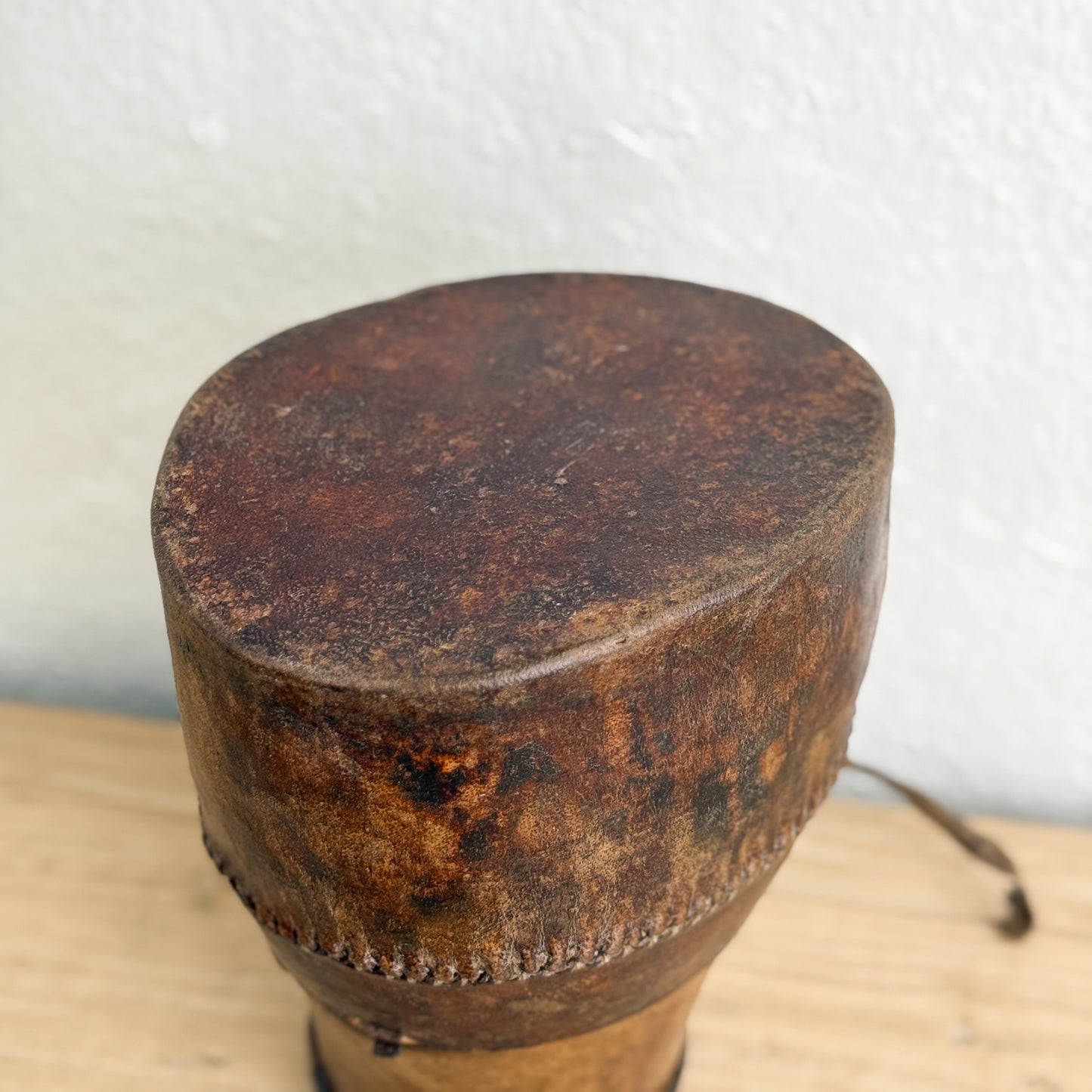 Rust-colored cork stopper on a white background