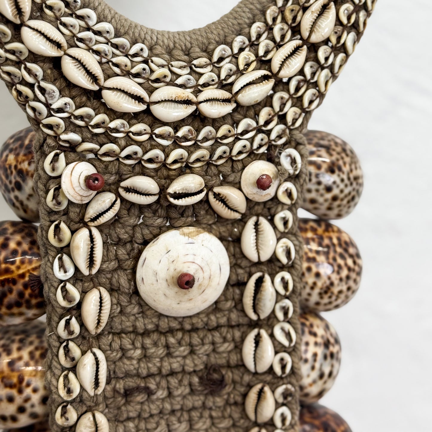 Decorative item with shell patterns on a white background