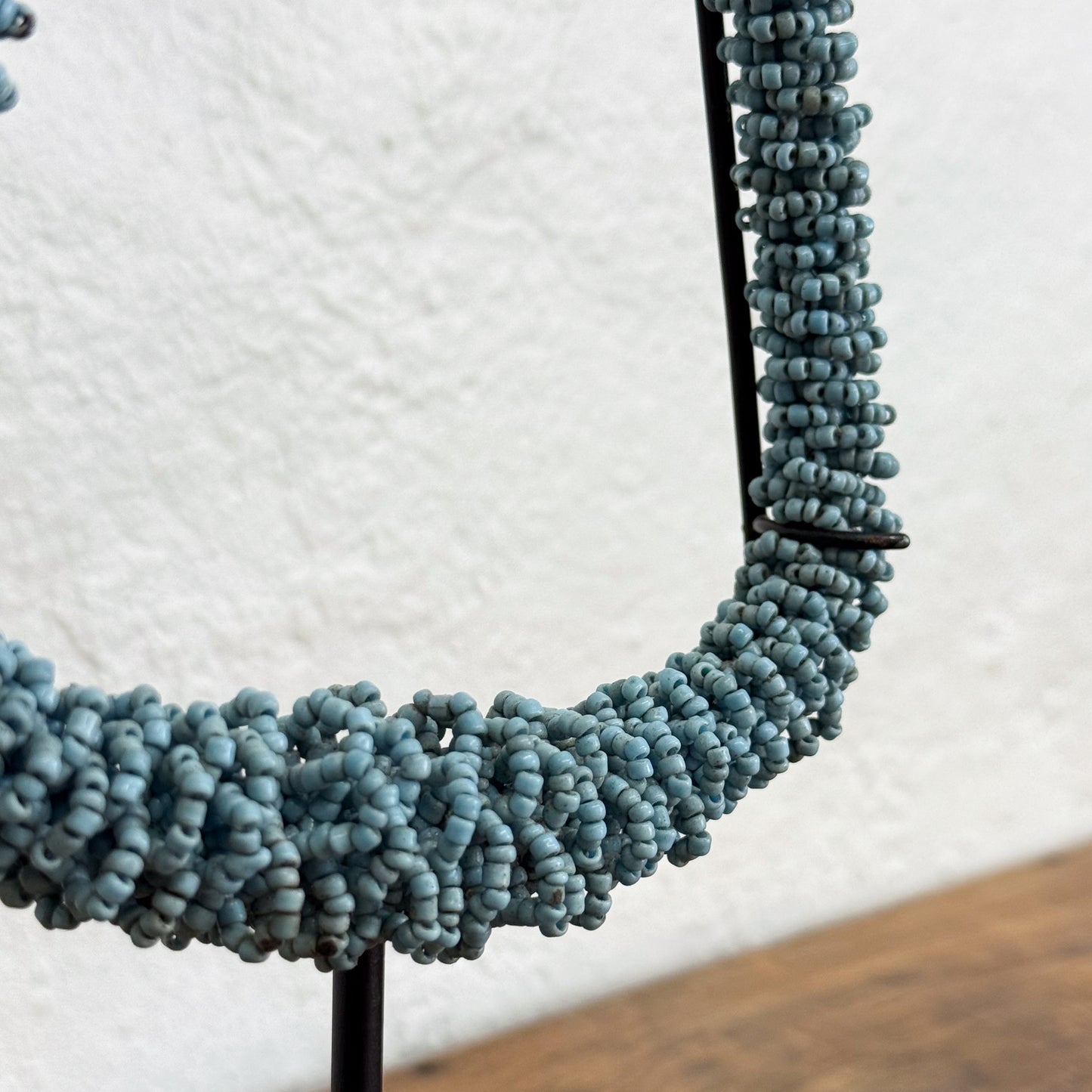 Close-up of a beaded necklace on a white background