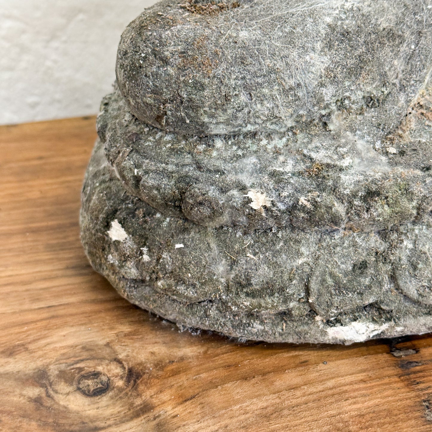 Gray stone on a wooden surface