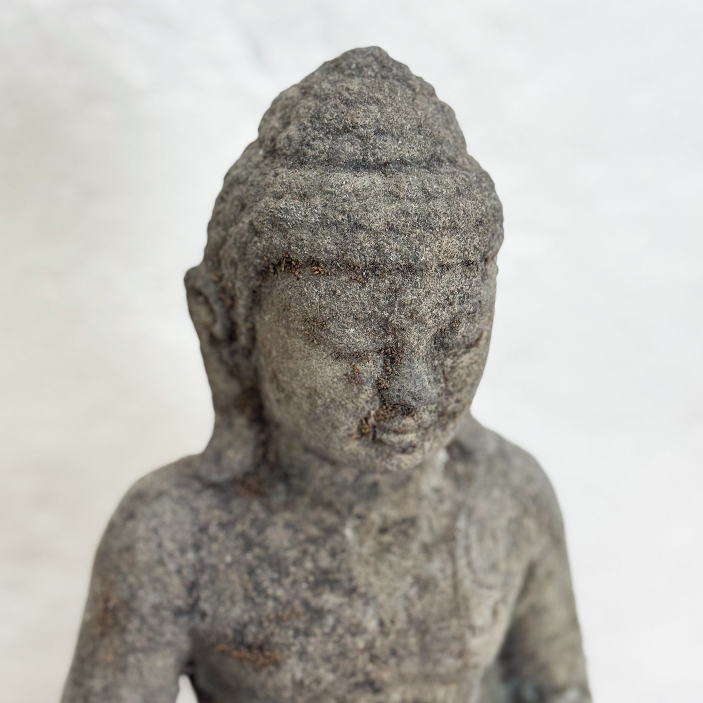 Stone statue of a seated figure 