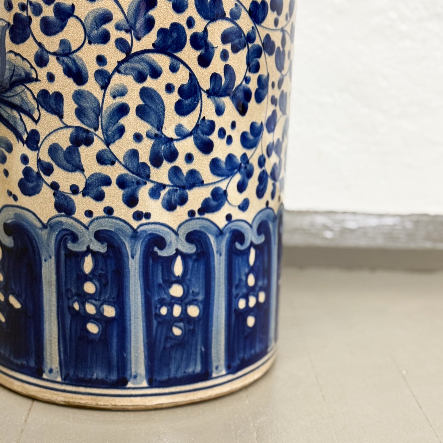 Ceramic vase with blue floral patterns on a light background