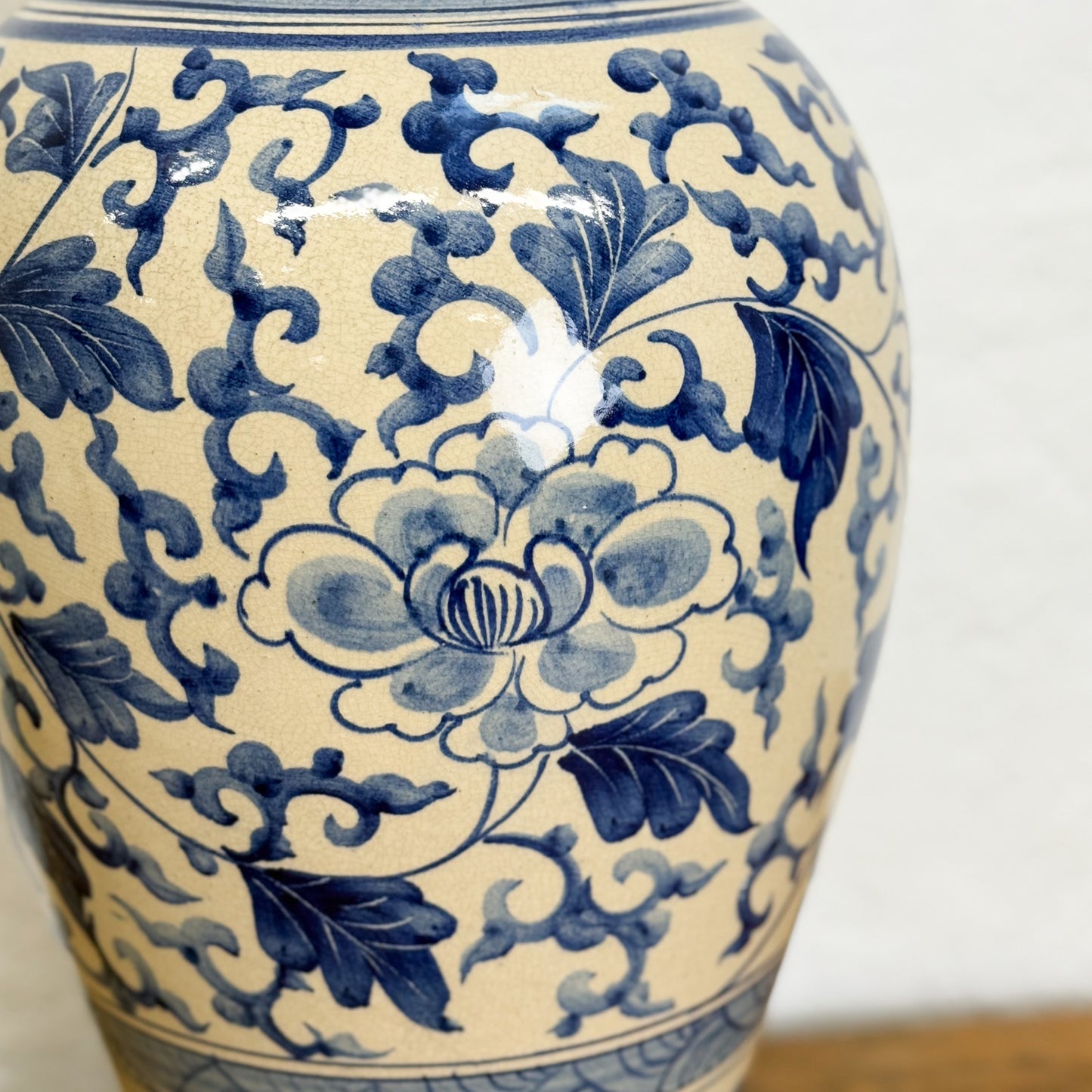 Close-up of a blue and white floral patterned ceramic vase.
