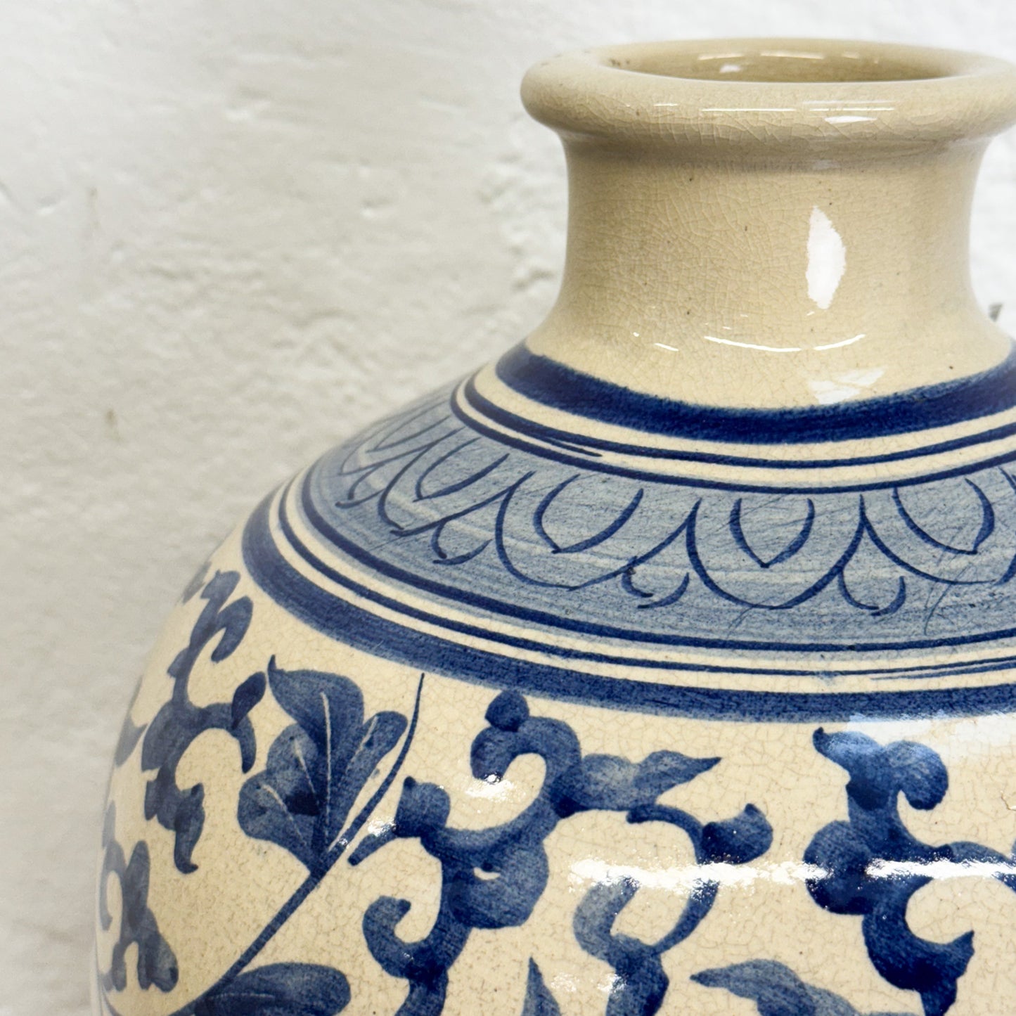 Ceramic vase with blue floral patterns on a white background