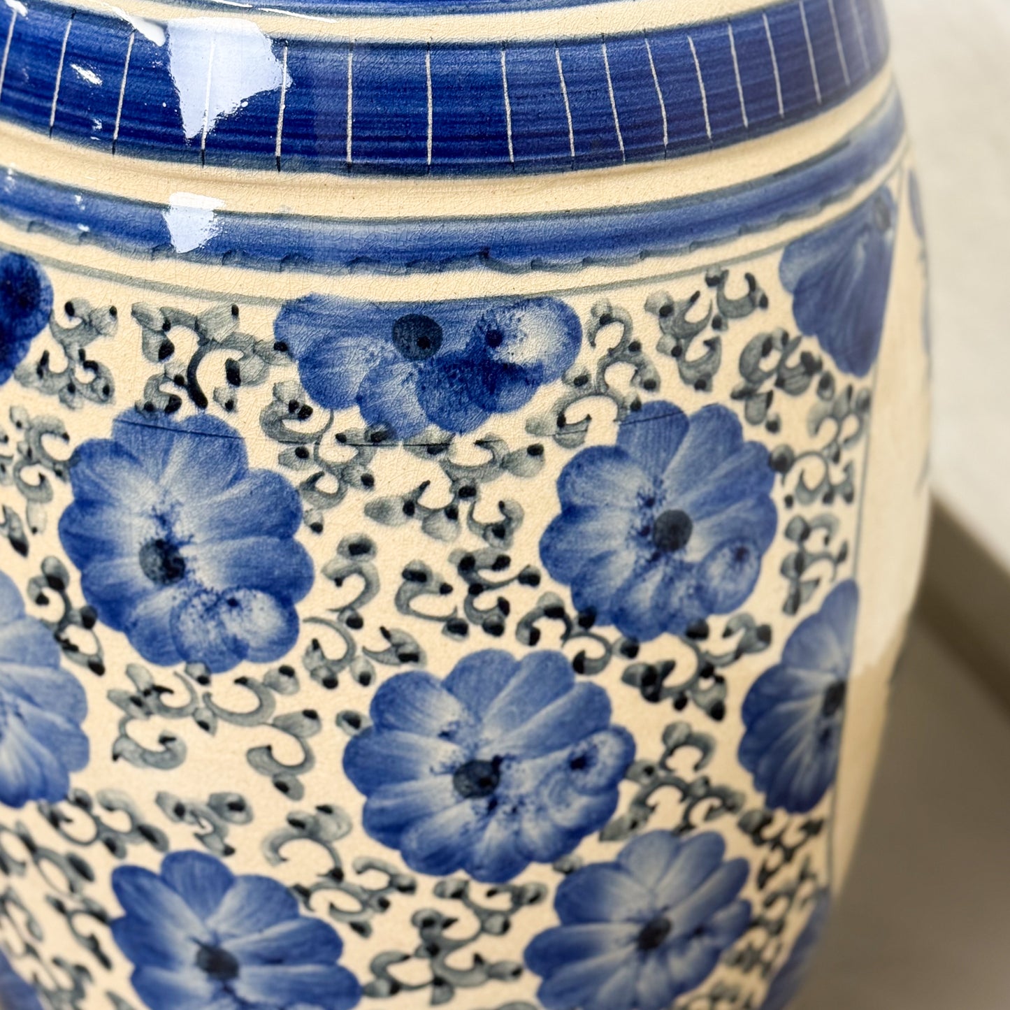 Ceramic vase with blue floral patterns on a white background