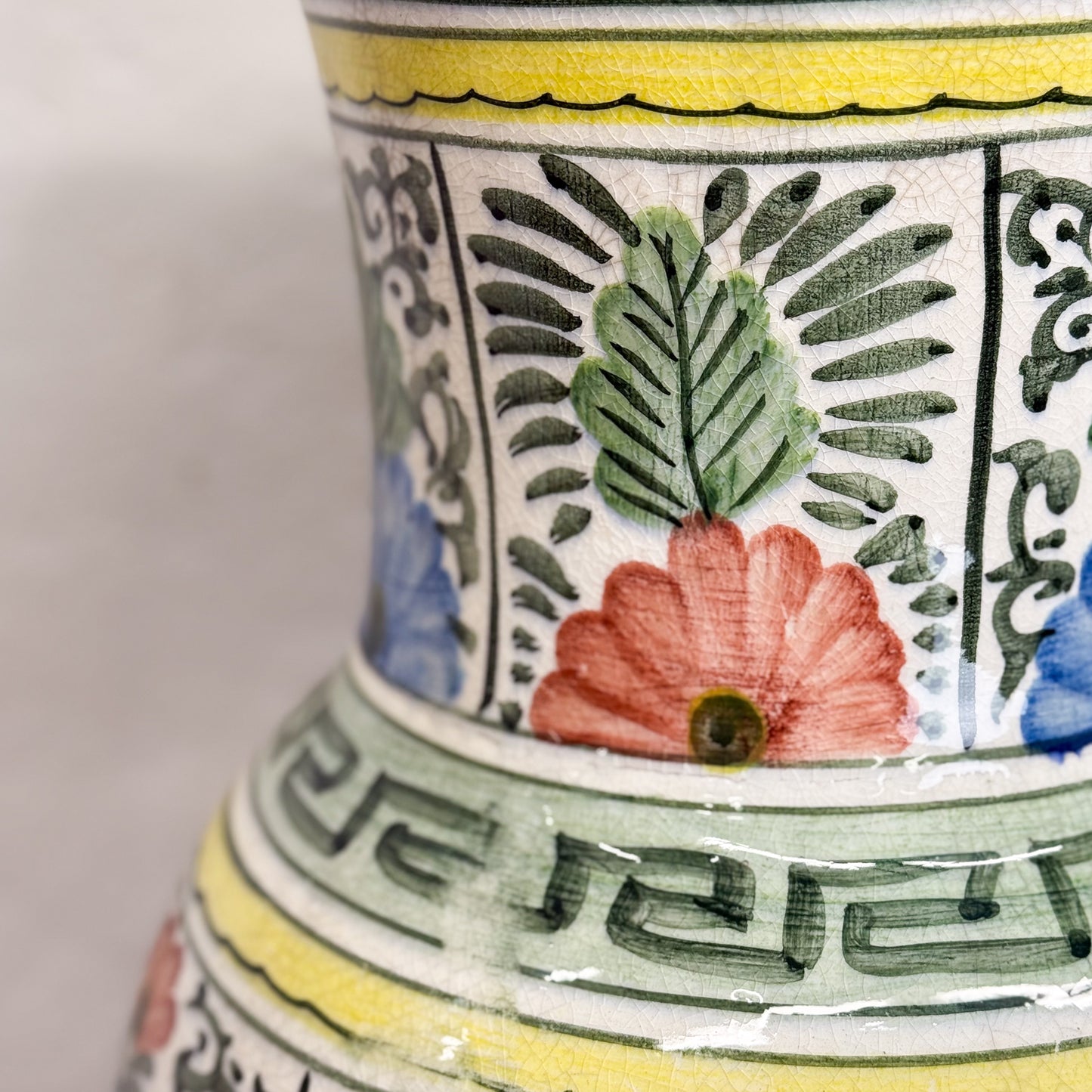 Close-up of a ceramic vase with floral and geometric patterns