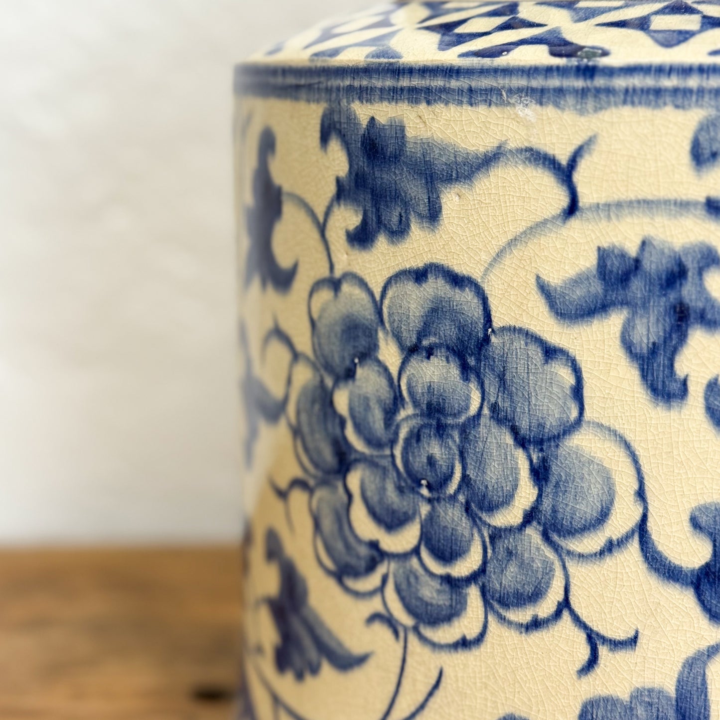 Ceramic jar with blue floral patterns on a white background