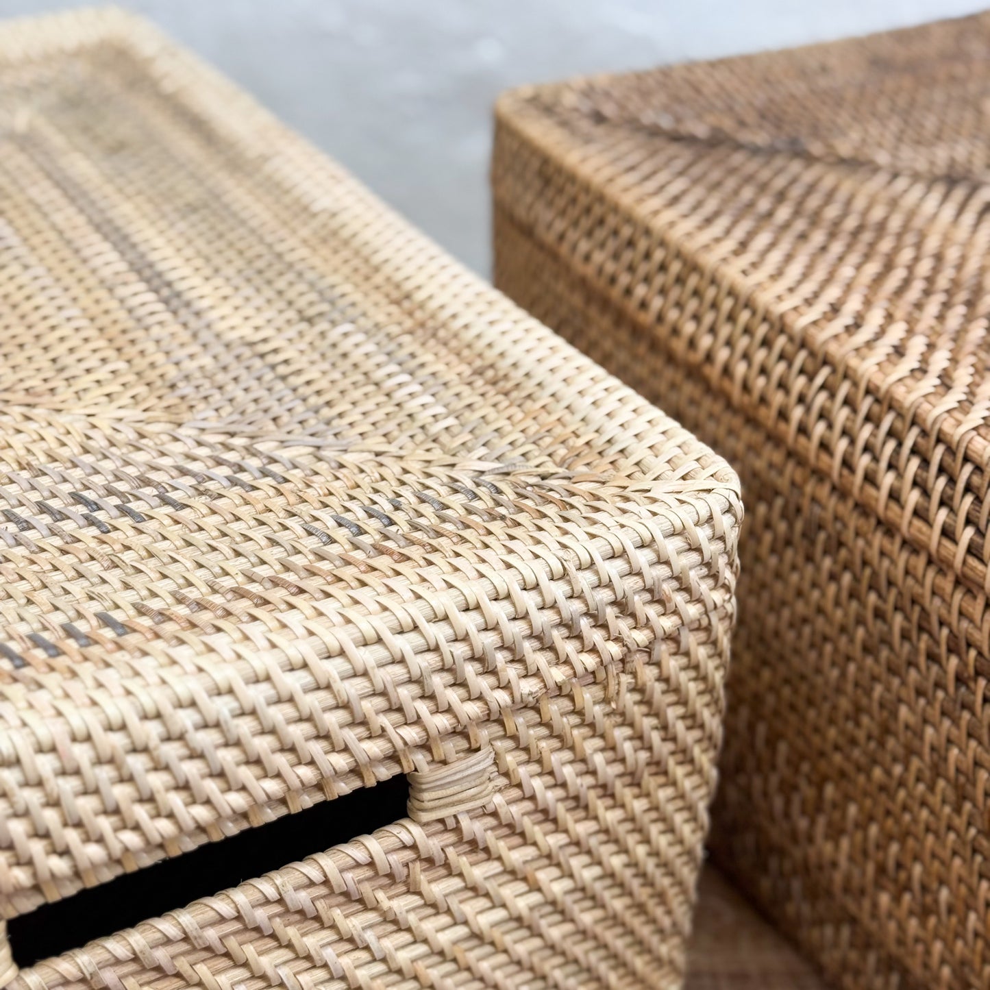 Close-up of woven stools with a neutral background