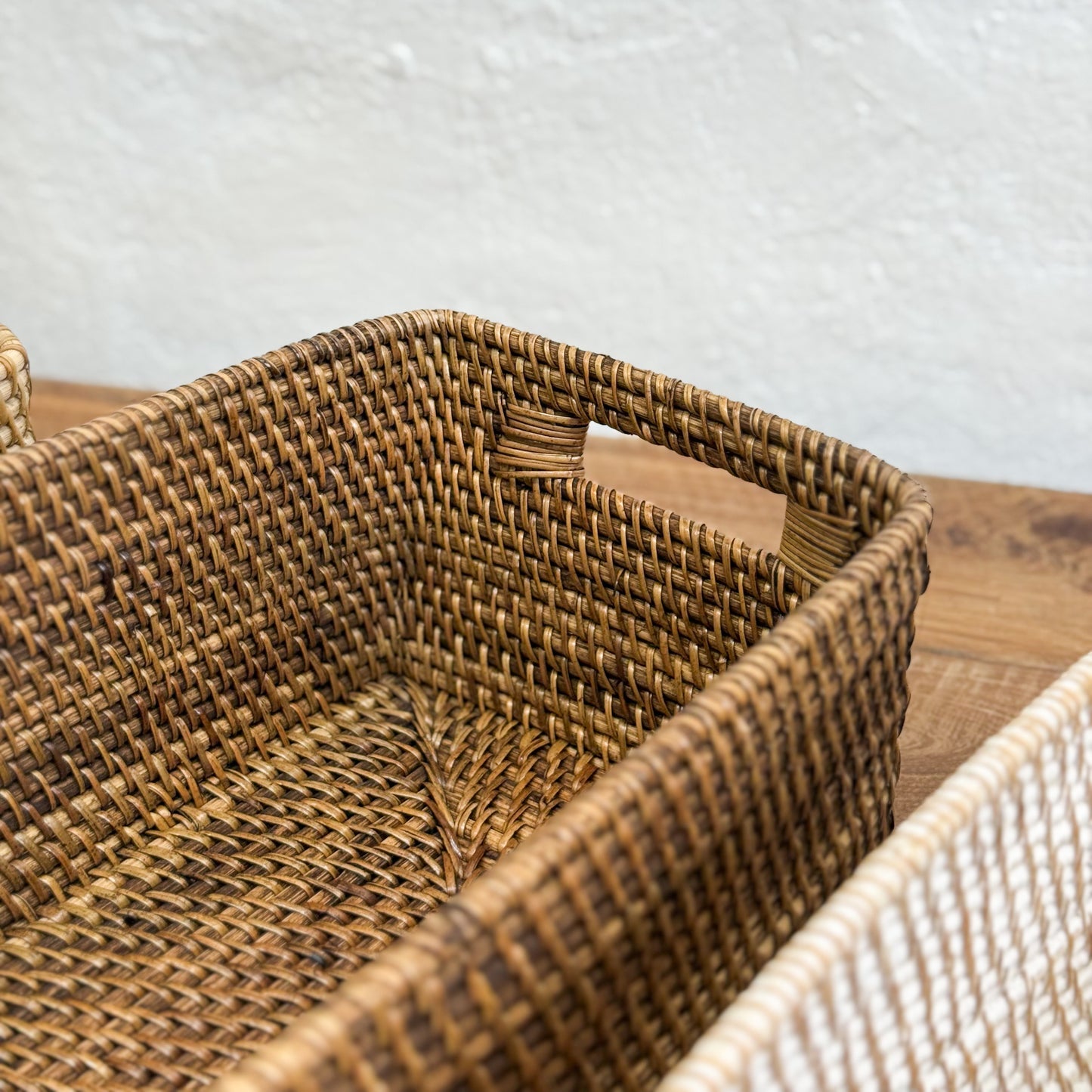 Woven basket with a textured surface on a wooden surface