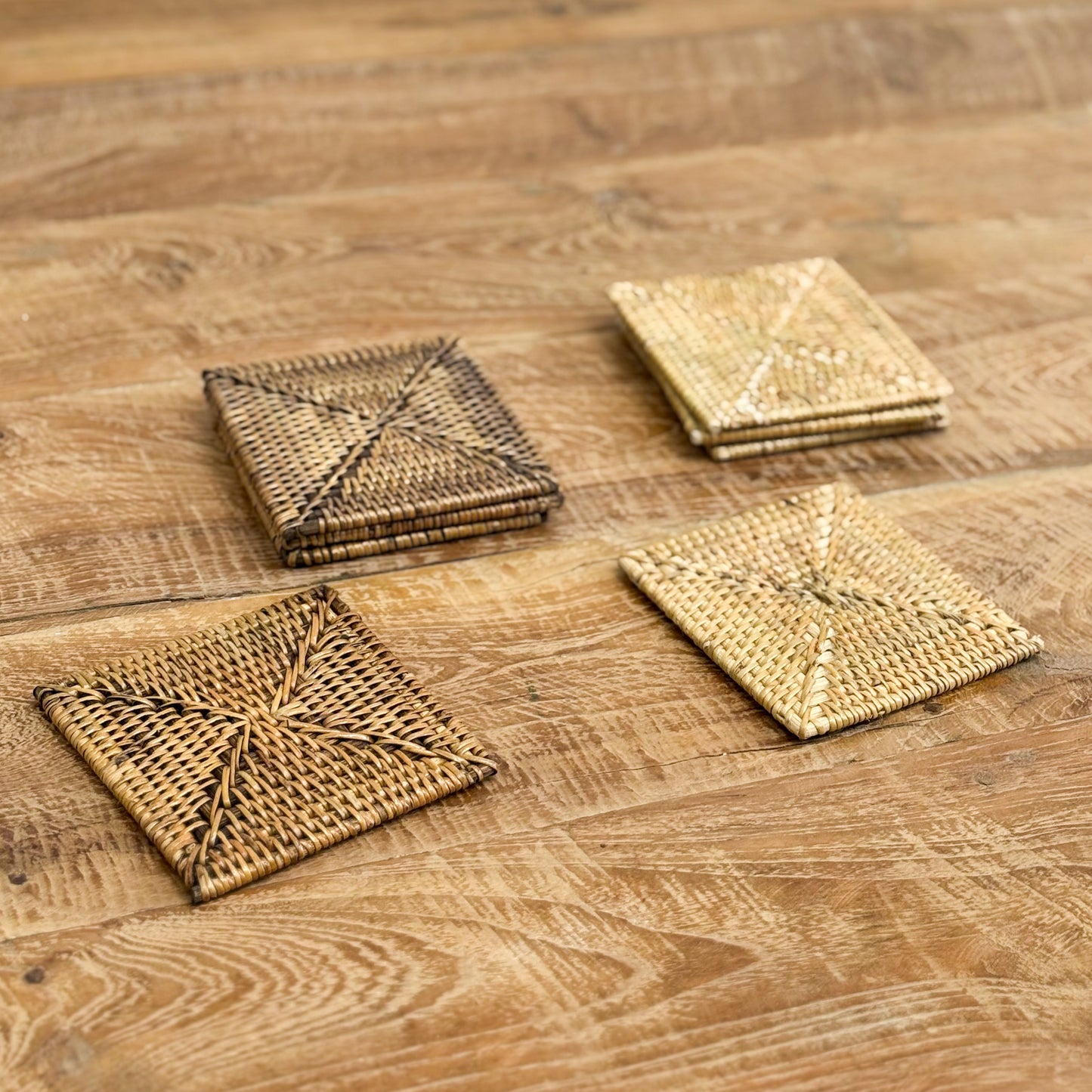 Set of woven coasters on a wooden surface