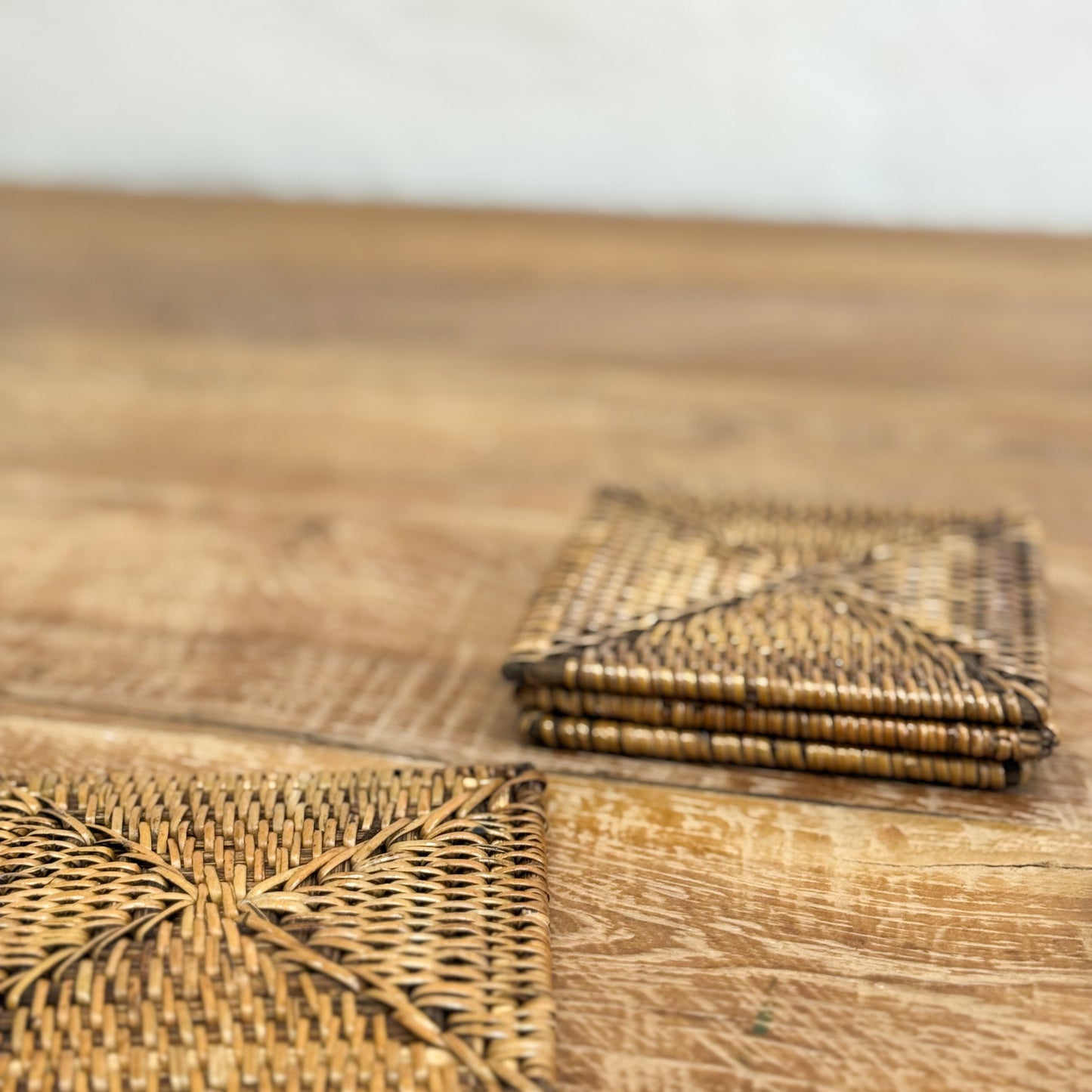 Woven placemats on a wooden surface