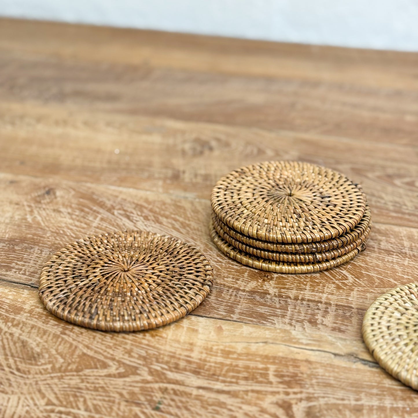 Wicker coasters on a wooden surface