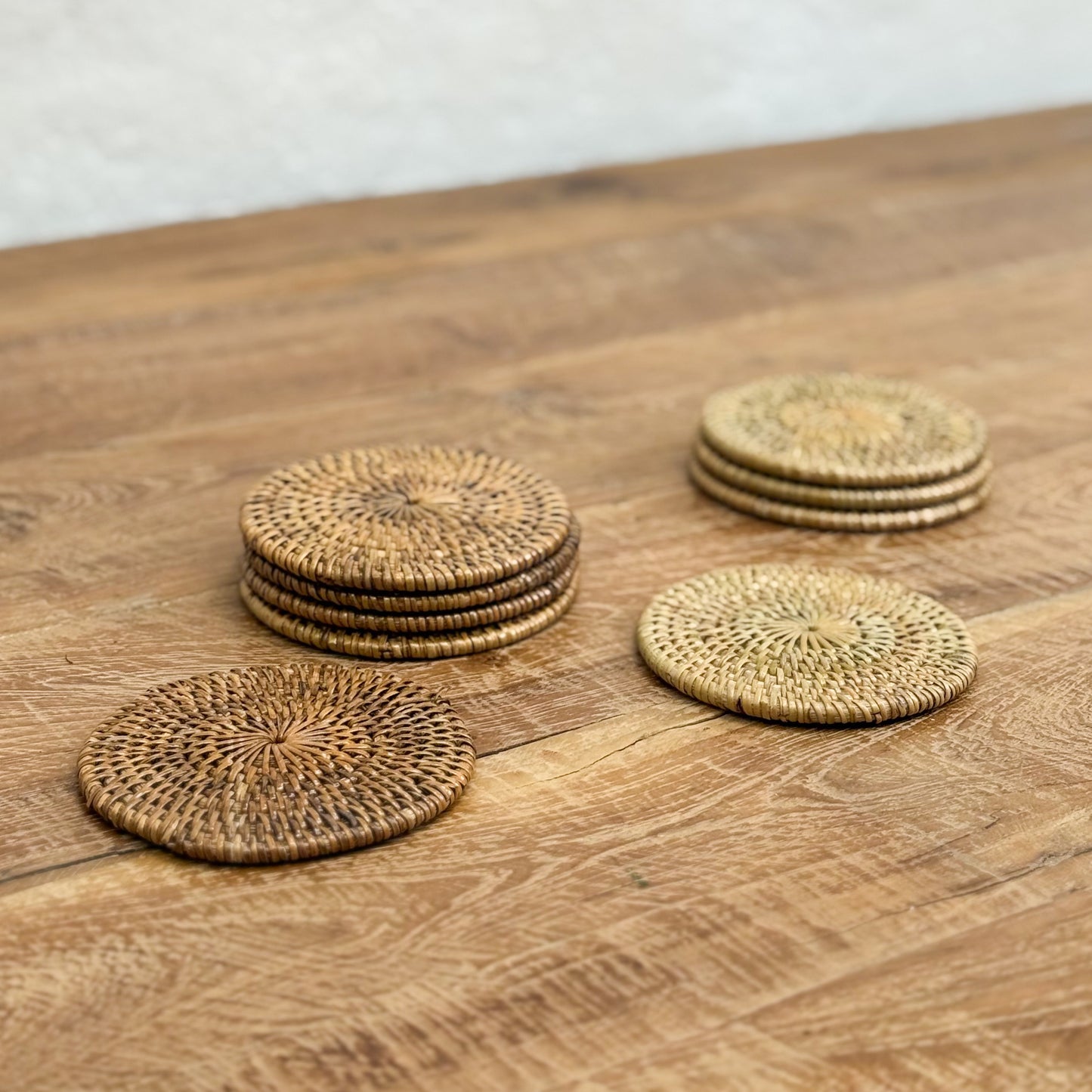 Set of woven coasters on a wooden surface