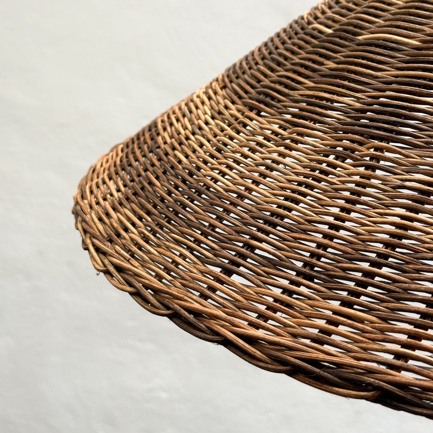 Close-up of a wicker basket on a light gray background