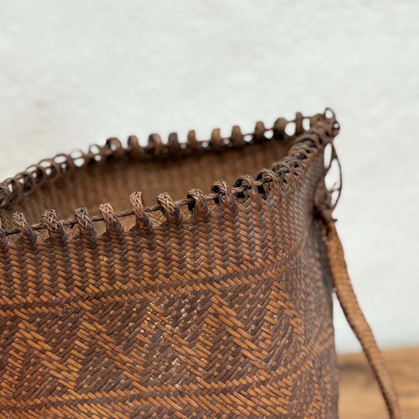 Close-up of a woven brown basket with a blurred background