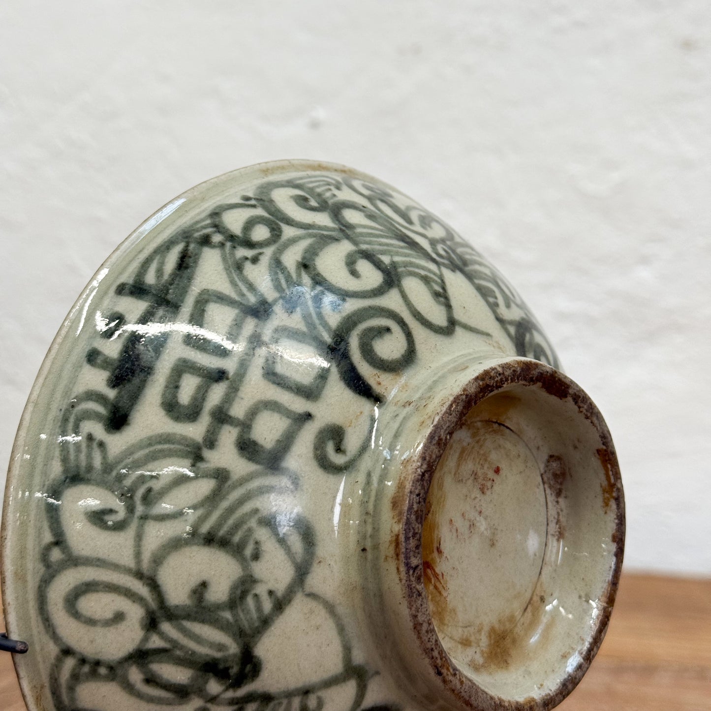Ceramic bowl with black decorative patterns on a white background