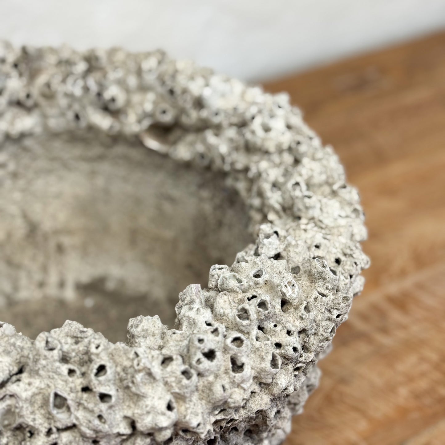 Decorative stone bowl on a wooden surface