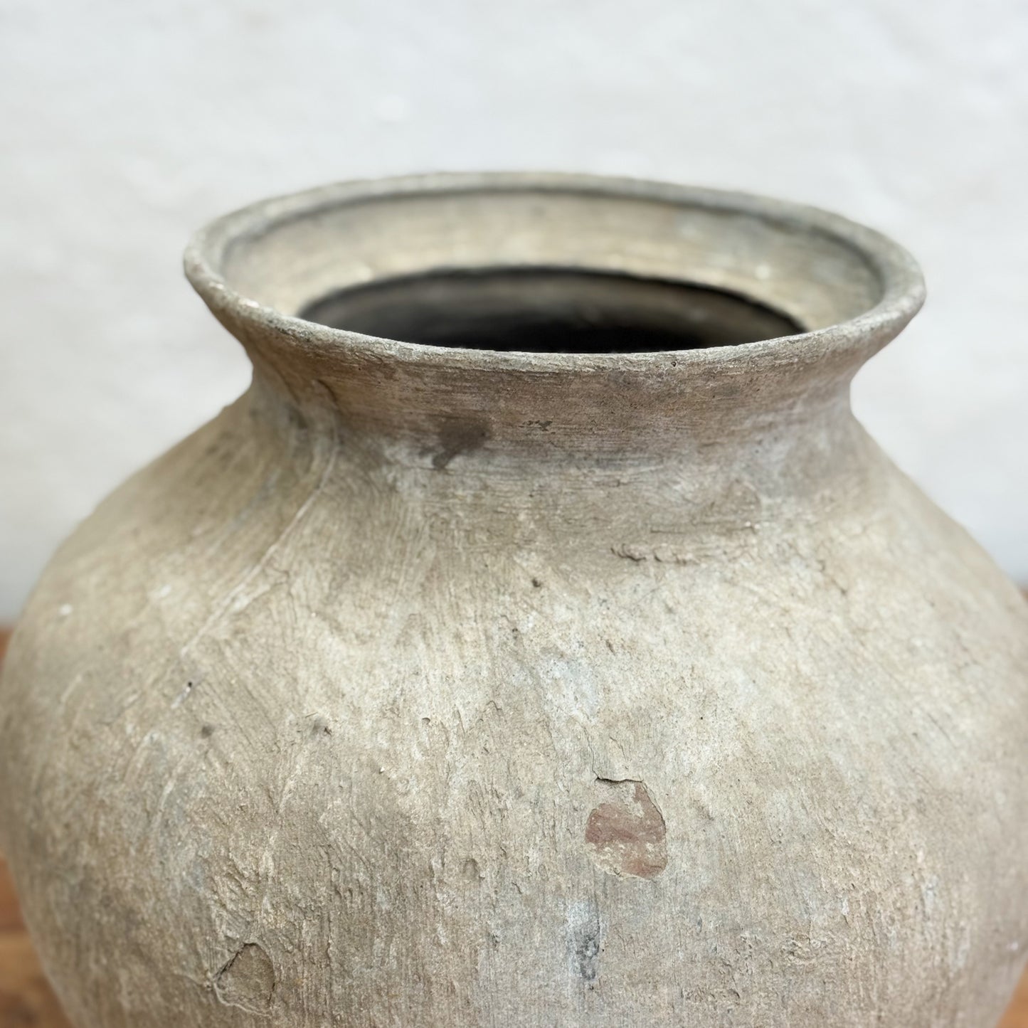 Vintage terracotta pot on a white background