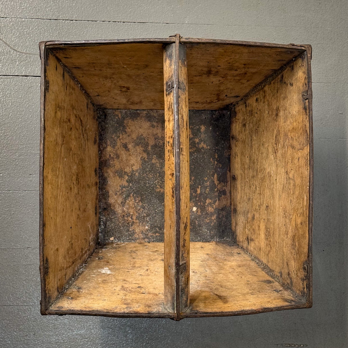 Old wooden crate on a gray background