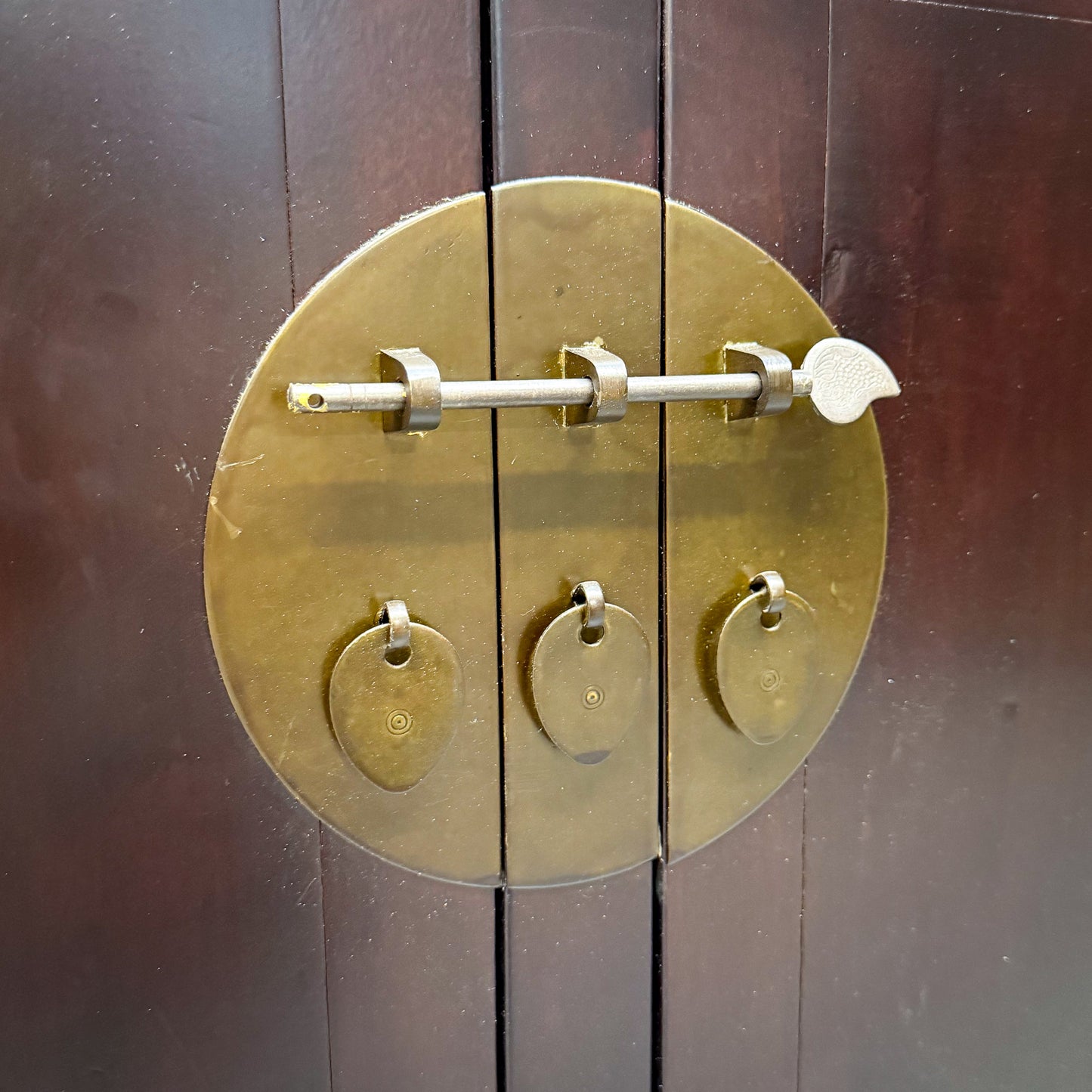 Brass door handle on a wooden door