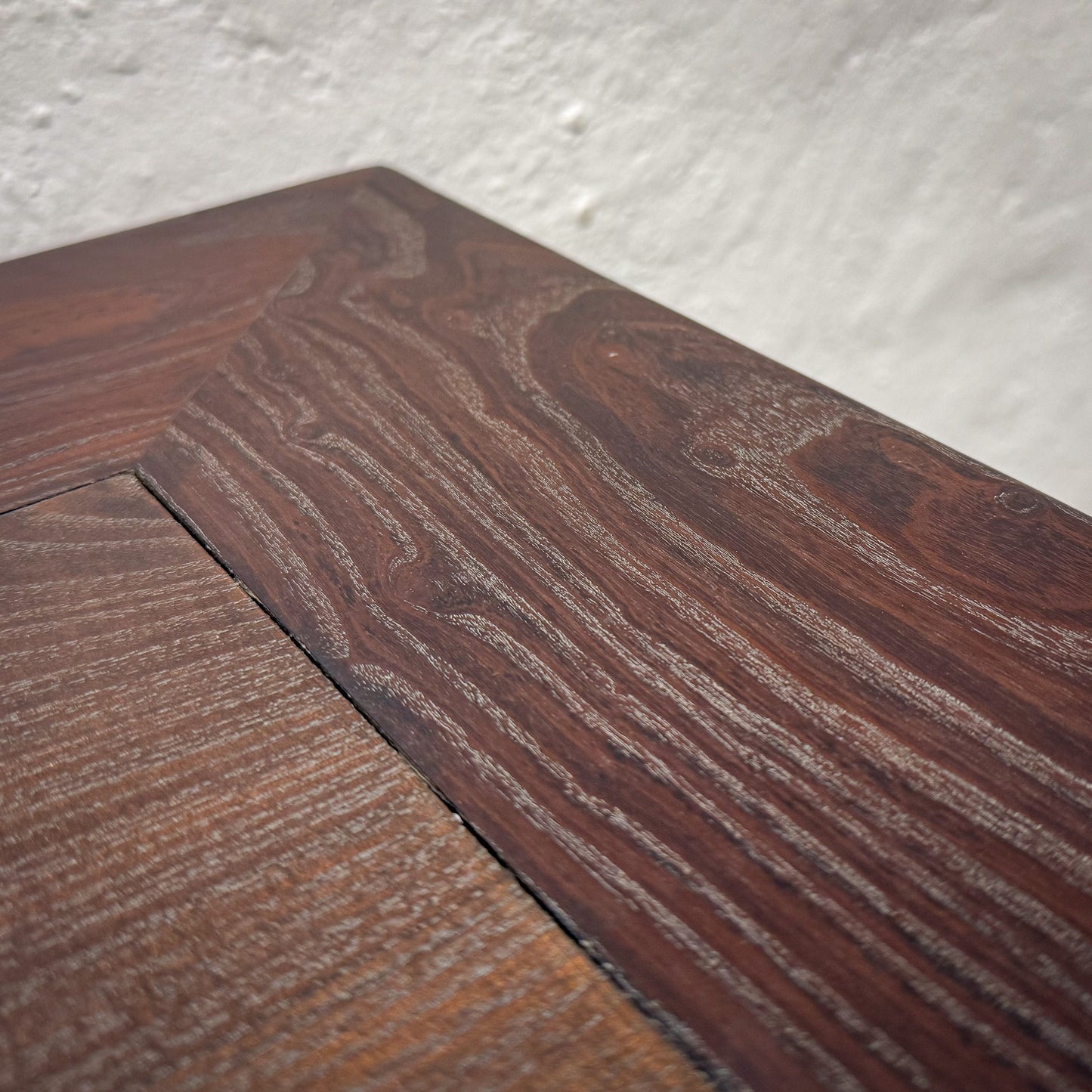 Close-up of wooden flooring with a focus on texture and grain.