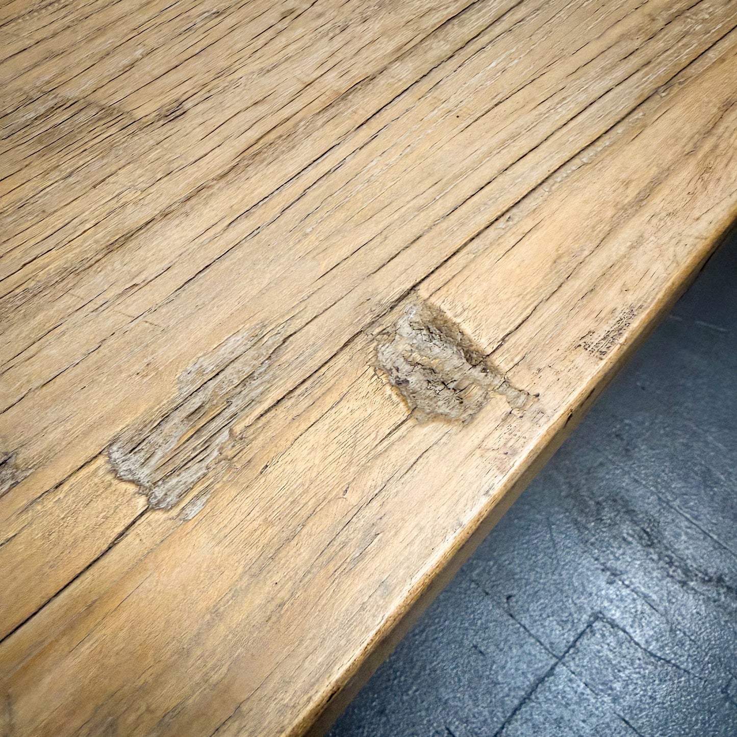 Close-up of a wooden surface with visible wear and tear