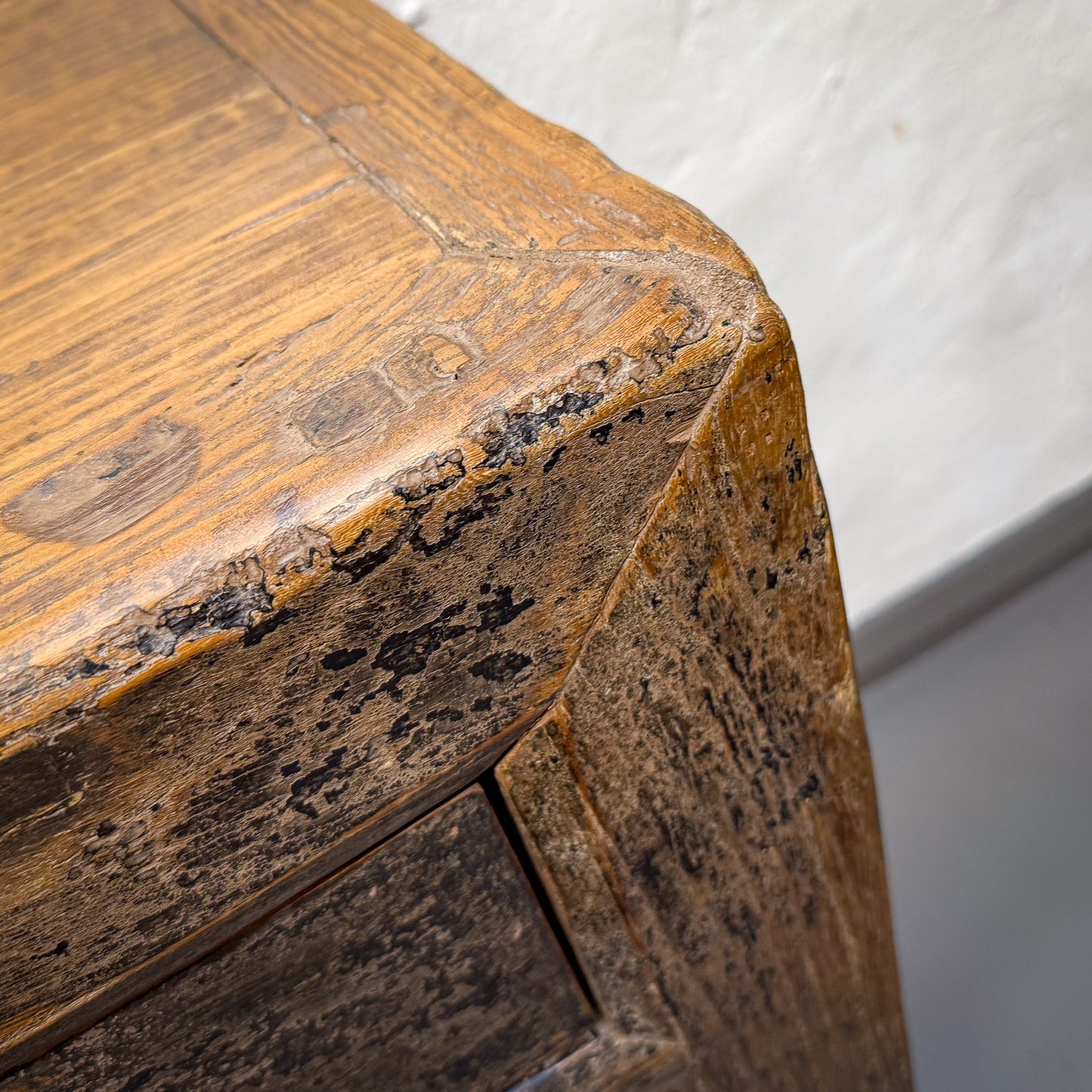 Close-up of a wooden surface with visible grain and texture
