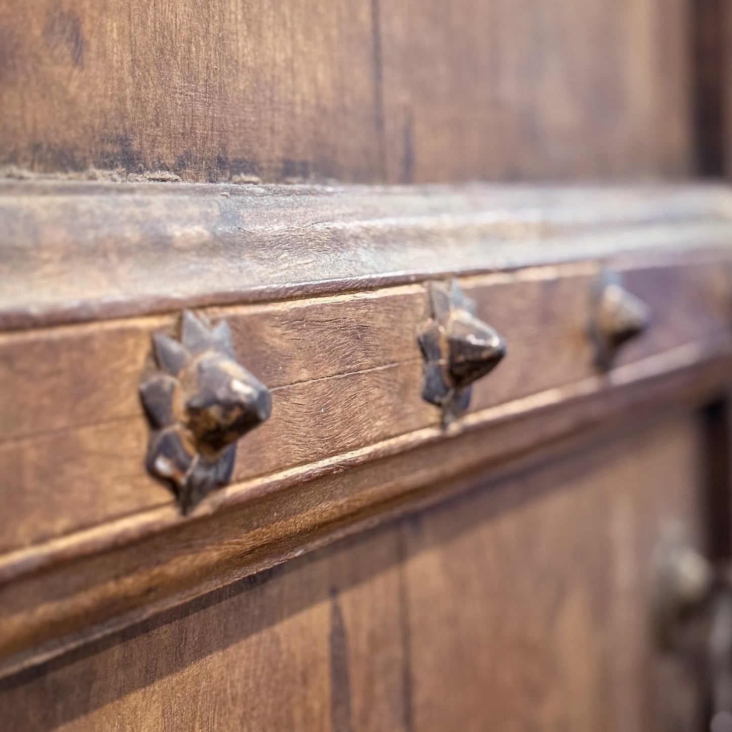 Close-up of a wooden chest with metal handles