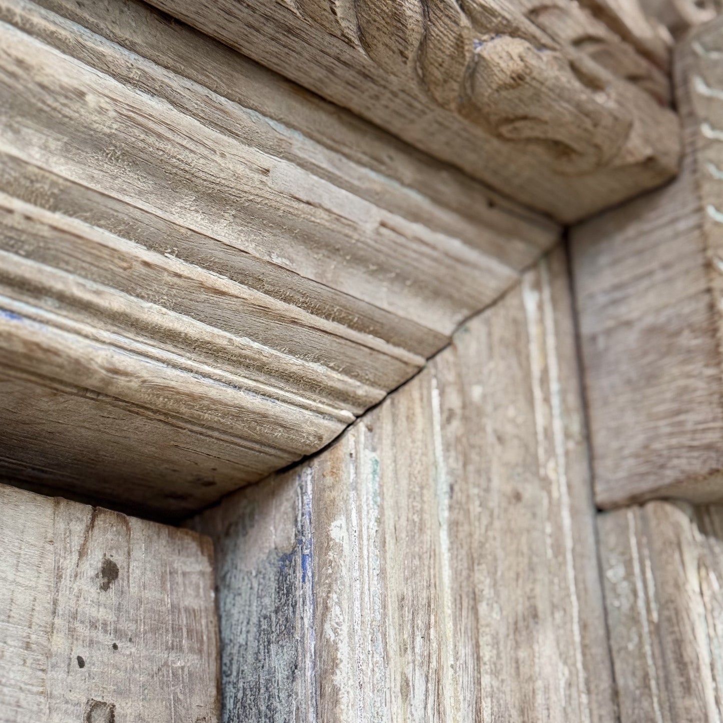 Close-up of stone architectural detail with carvings