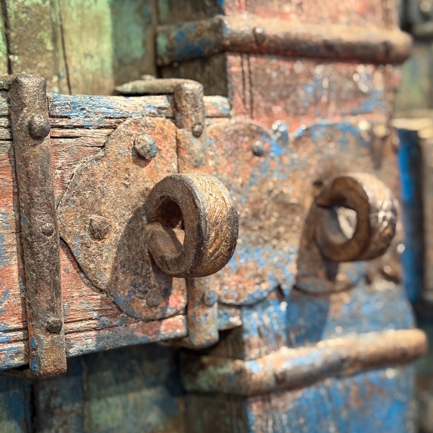 Rust-covered metal lock on a wooden surface