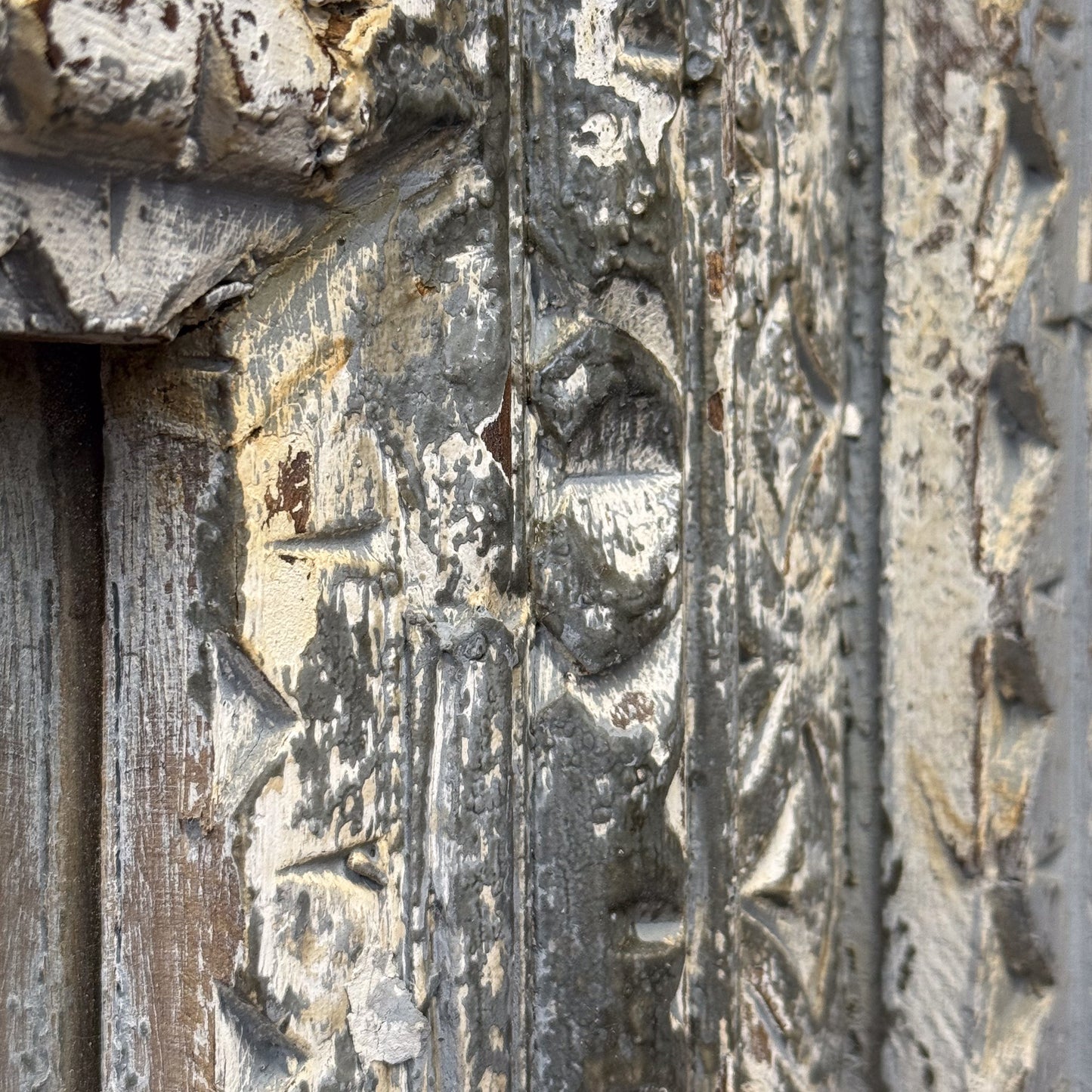 Close-up of an aged stone surface with intricate carvings