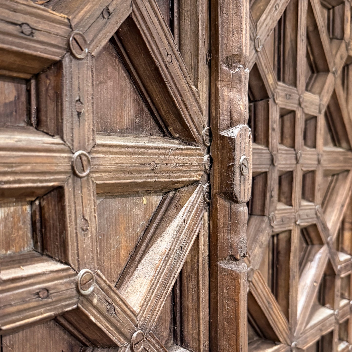 Close-up of a wooden panel with geometric patterns