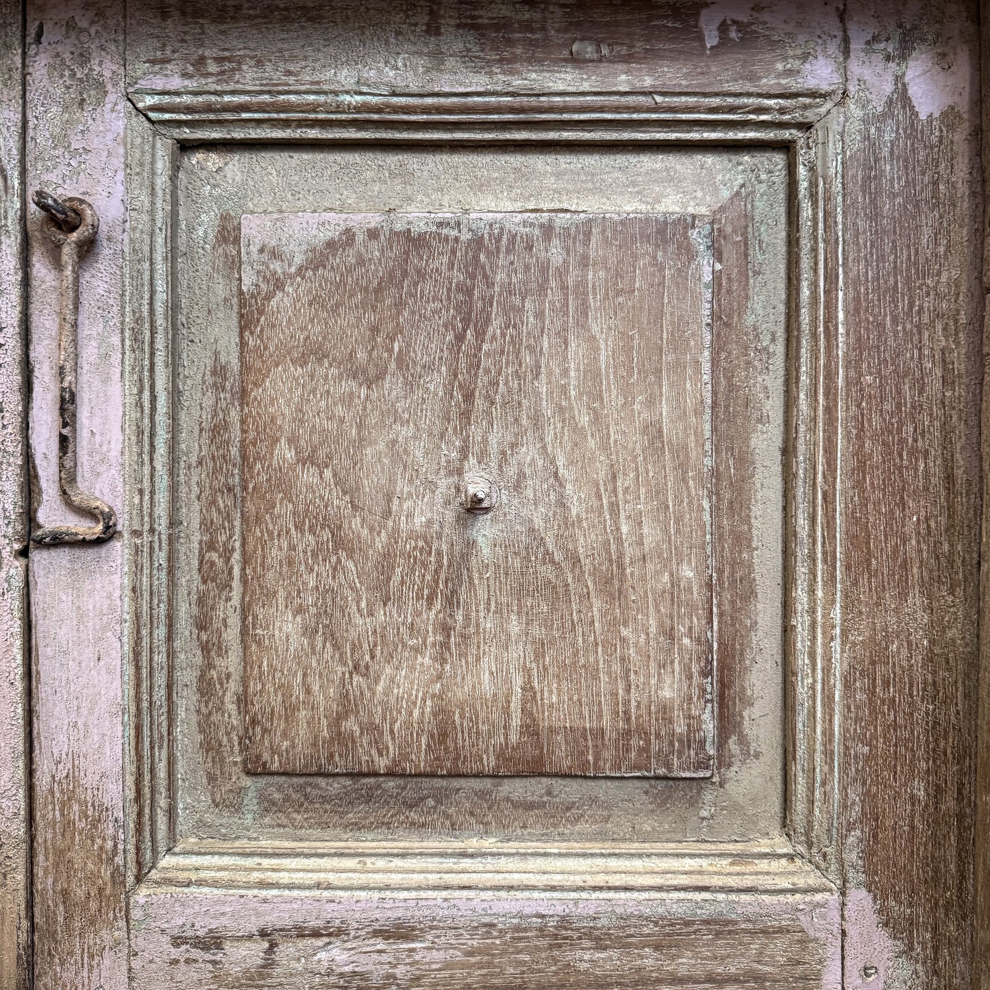 Close-up of a wooden door with a metal handle