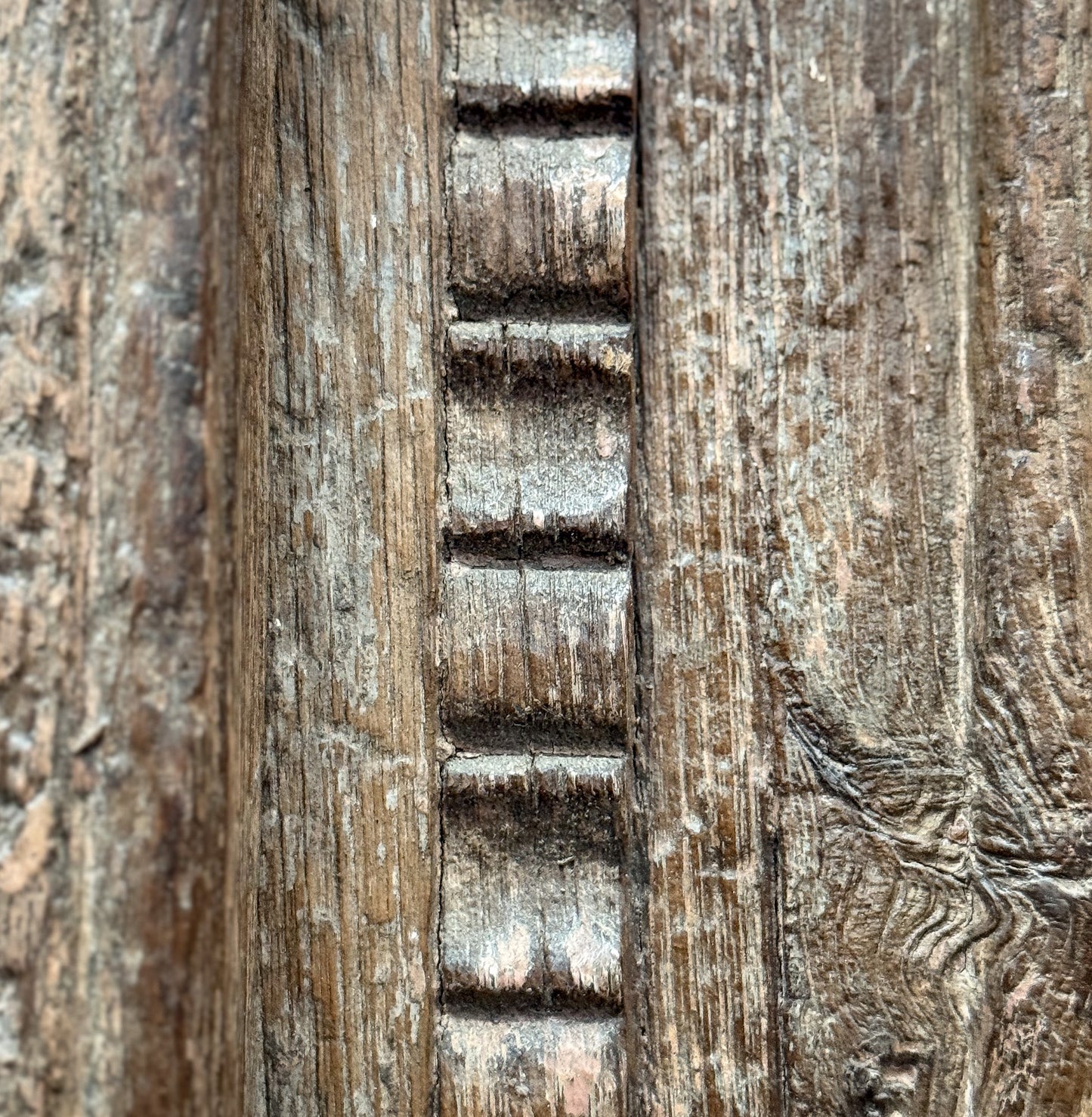 Close-up of wooden texture with a gear-like pattern