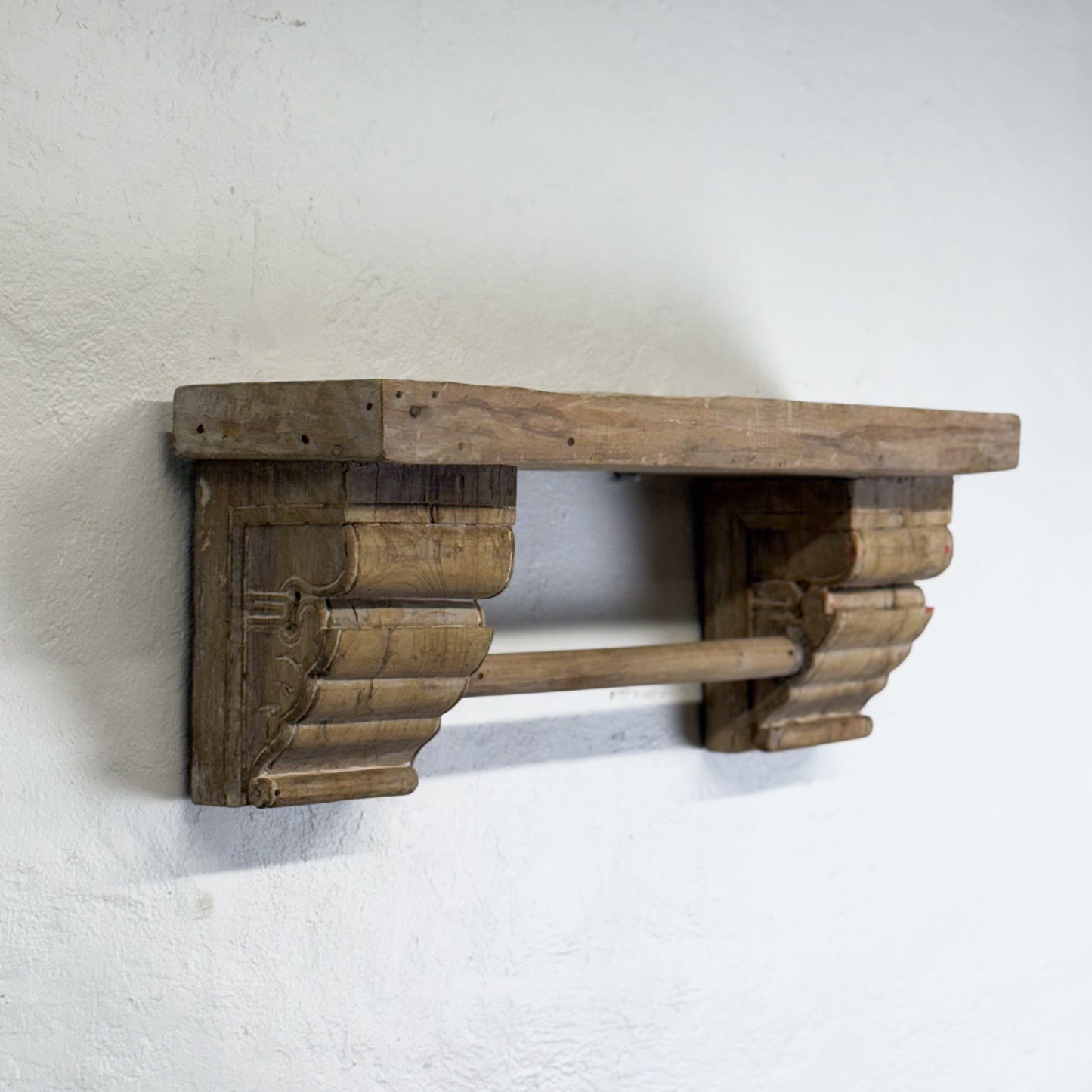 Wooden shelf bracket on a white background