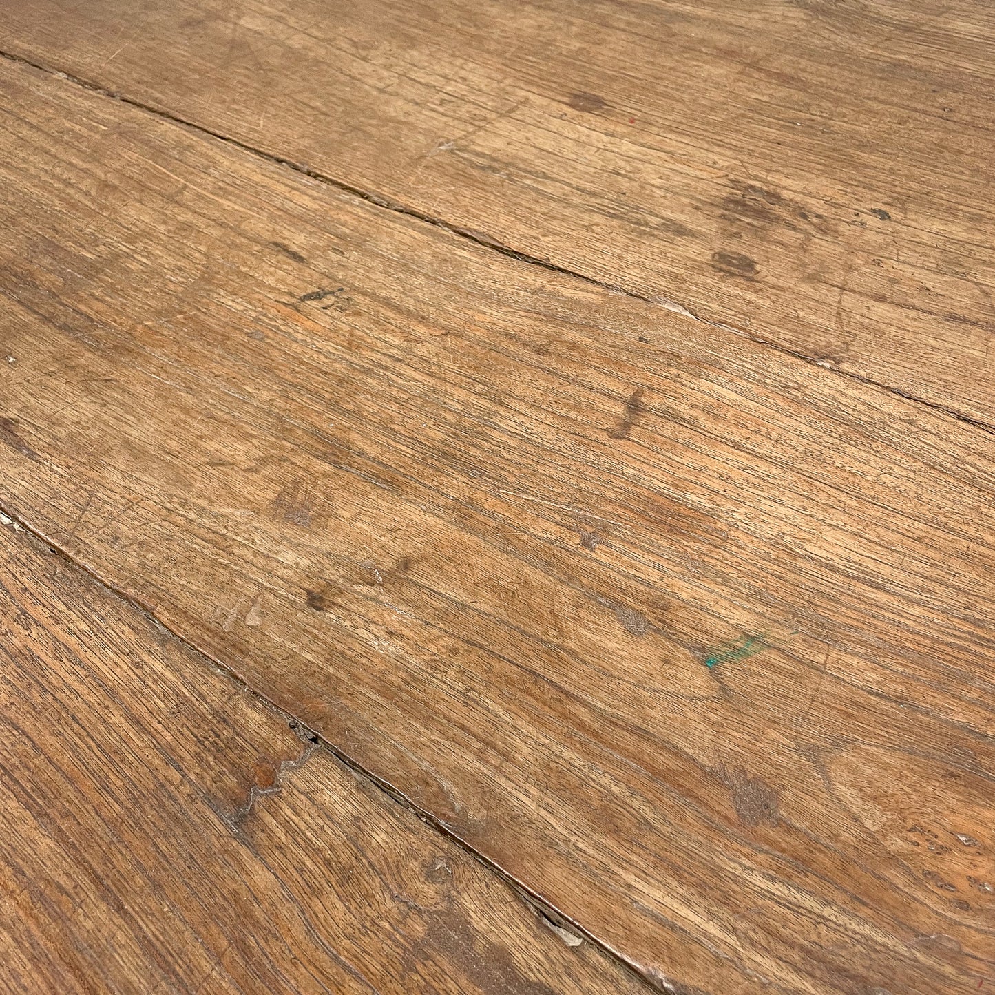 Close-up of a wooden surface with visible grain and texture