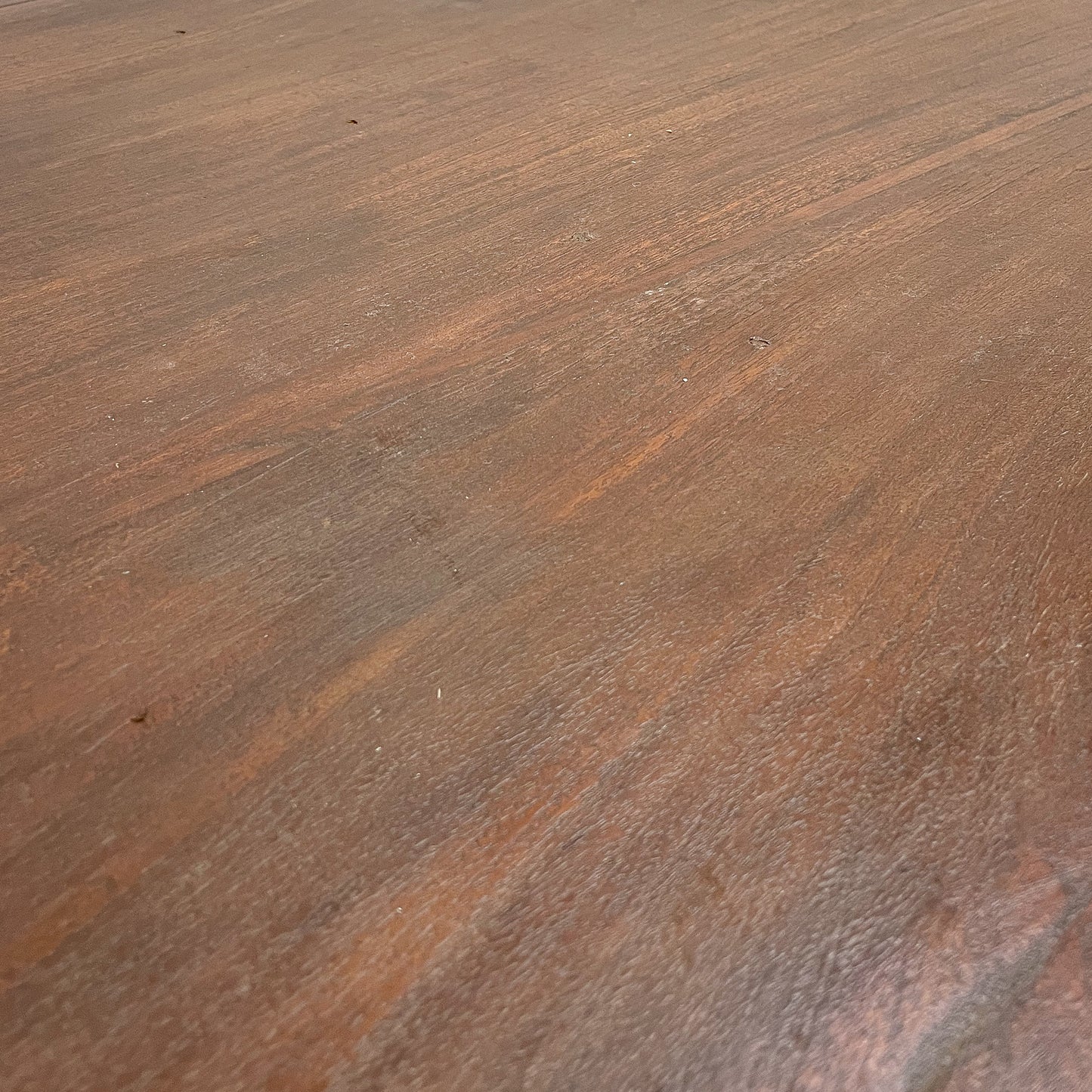 Close-up of a brown wooden surface with visible grain and texture