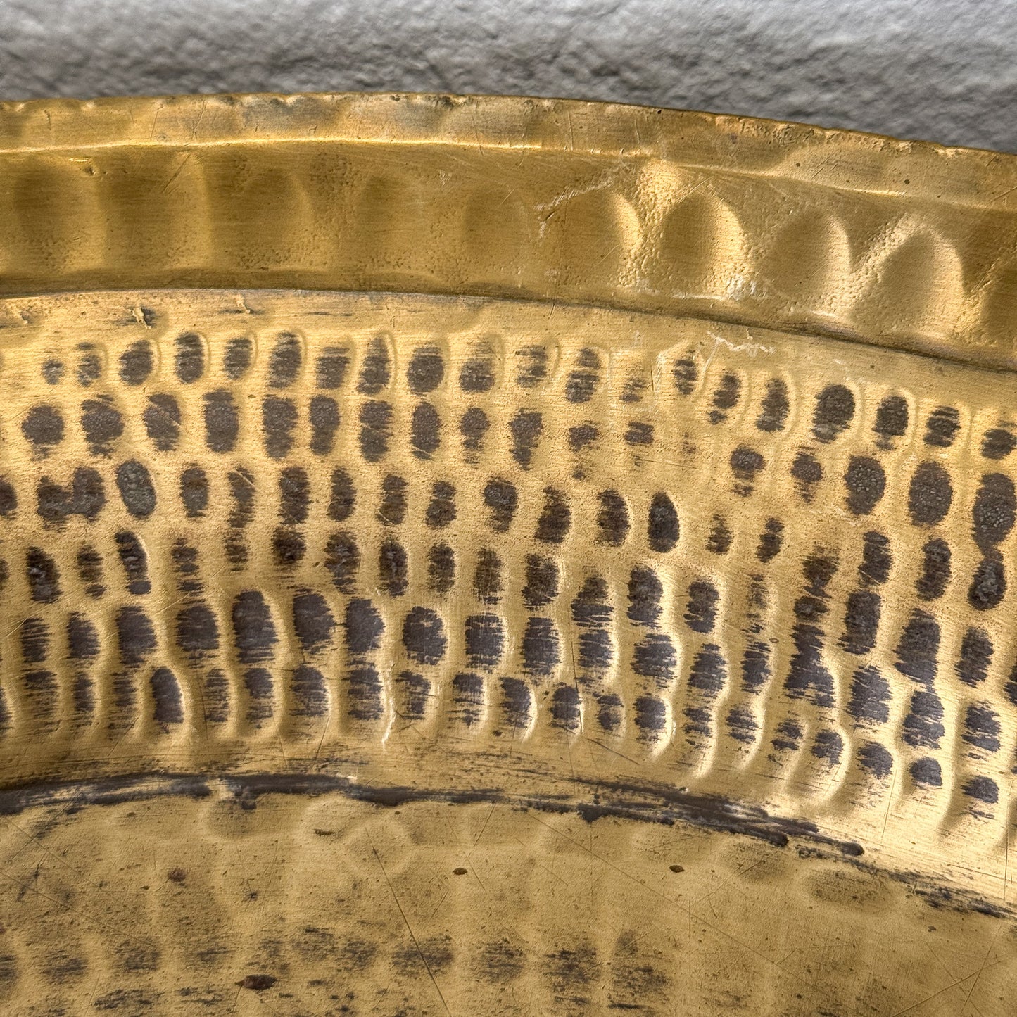 Close-up of a textured gold object with patterns