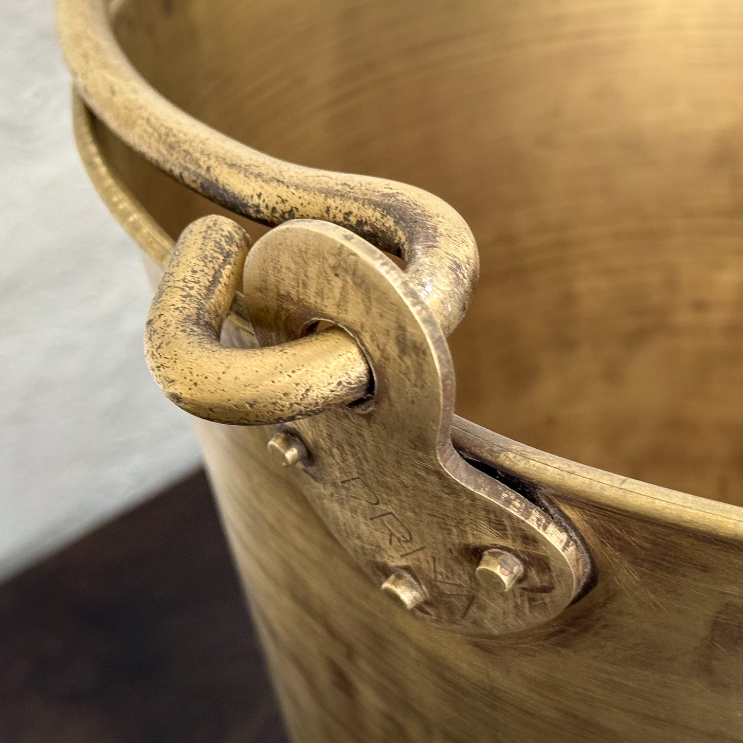 Close-up of a brass bucket with a handle